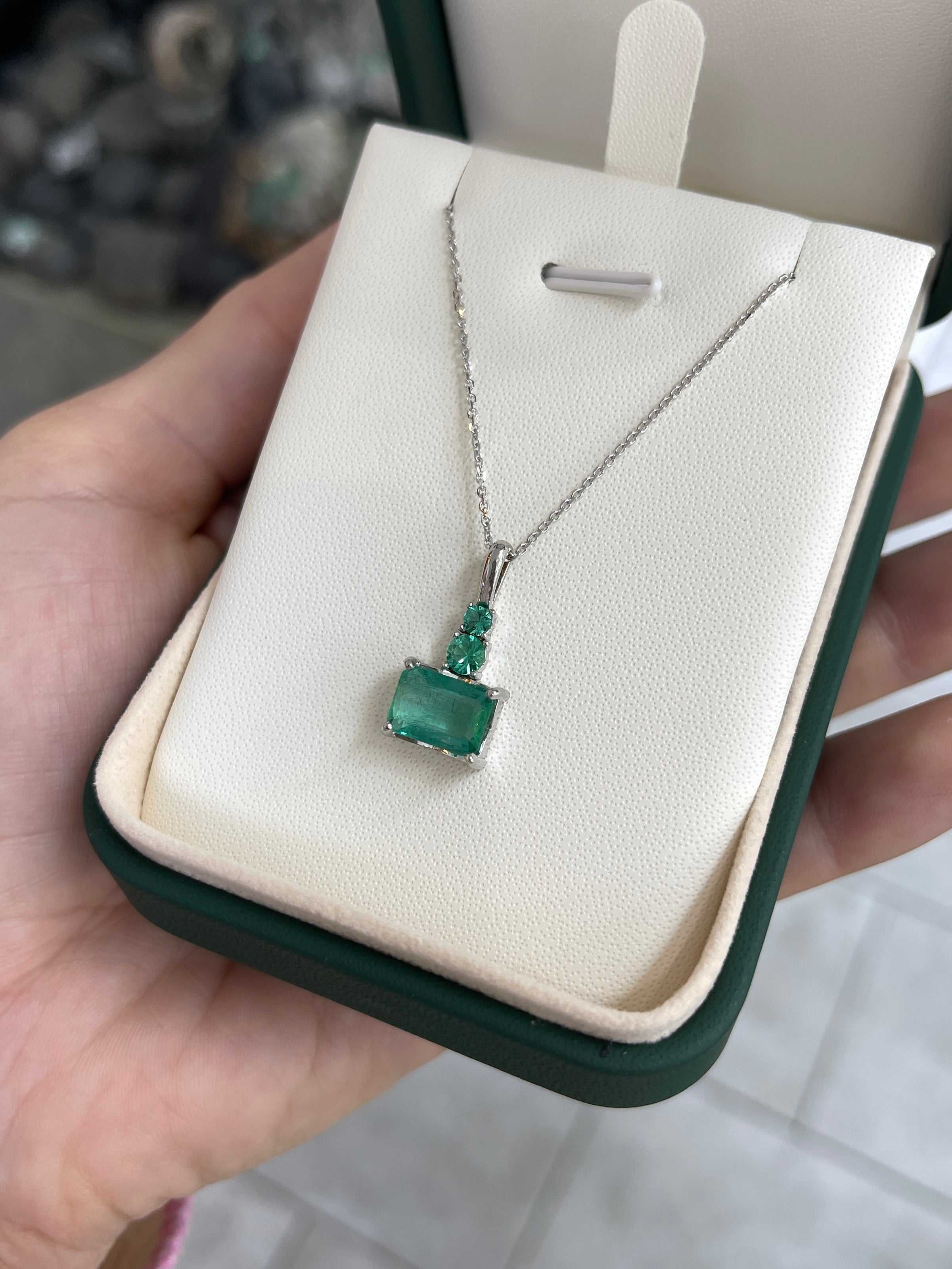 JR Colombian Emeralds 2.43tcw clear East-West emerald and round emerald accent necklace in 14K white gold, showcasing sparkling gemstones.