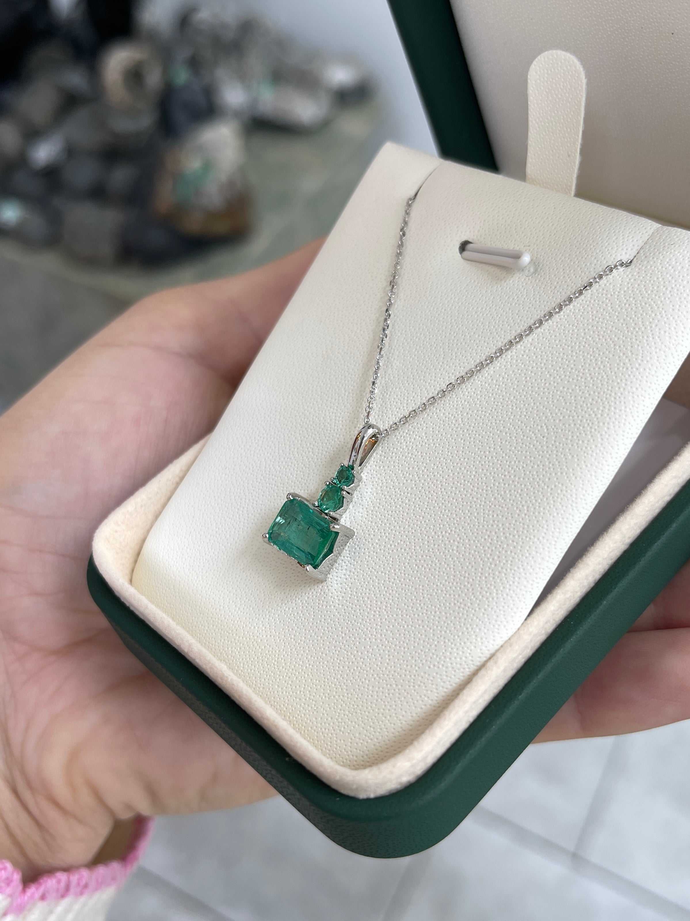 JR Colombian Emeralds 14K white gold necklace with 2.43tcw crystal clear east-west emerald and round emerald accent stones.