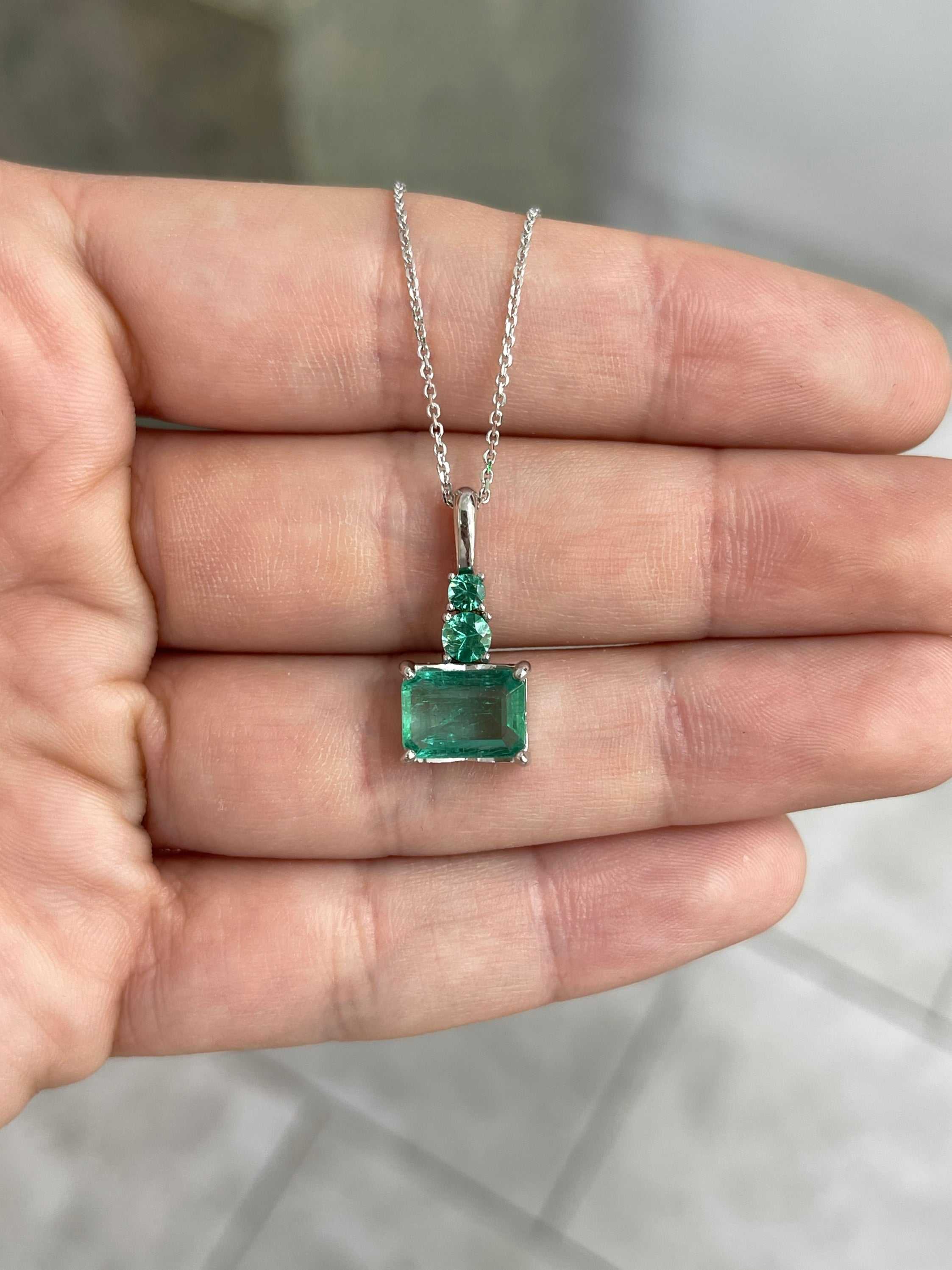 JR Colombian Emeralds 14K white gold necklace with 2.43tcw clear east-west emerald and round emerald accents.