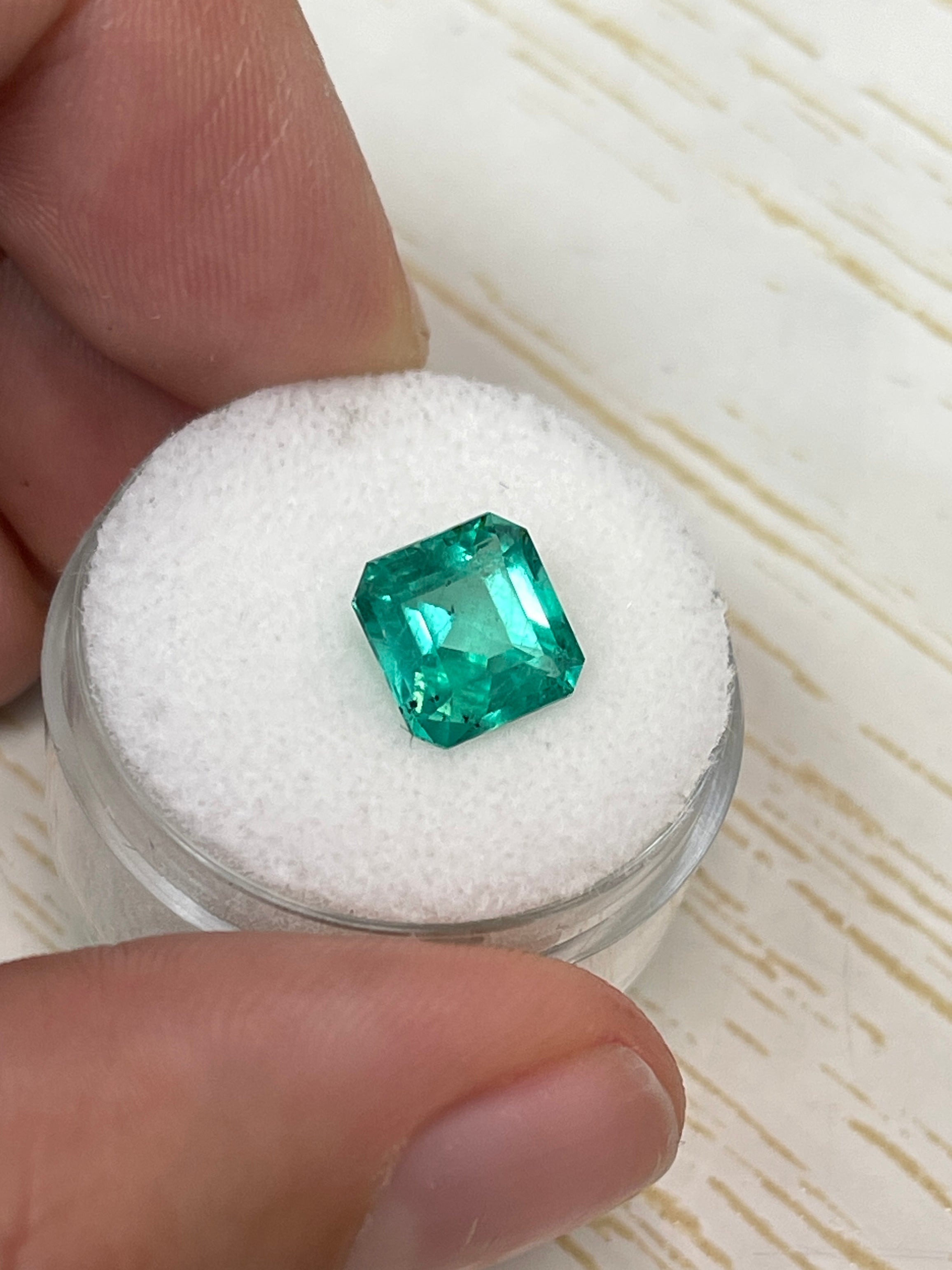 2.44-carat freckled bluish-green natural Colombian emerald loose Asscher cut gemstone from JR Colombian Emeralds.