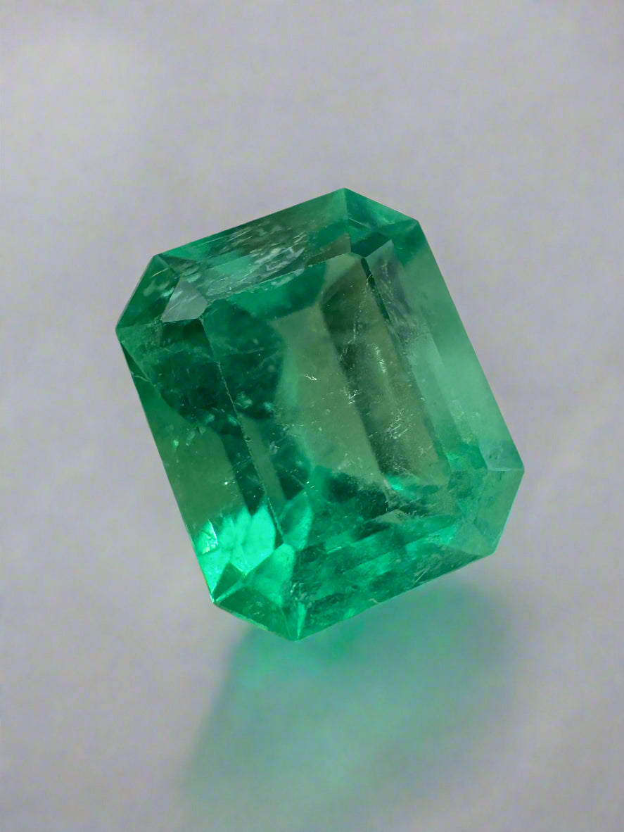 Loose 2.47 carat yellowish green Colombian emerald in an emerald cut, natural gemstone from JR Colombian Emeralds.