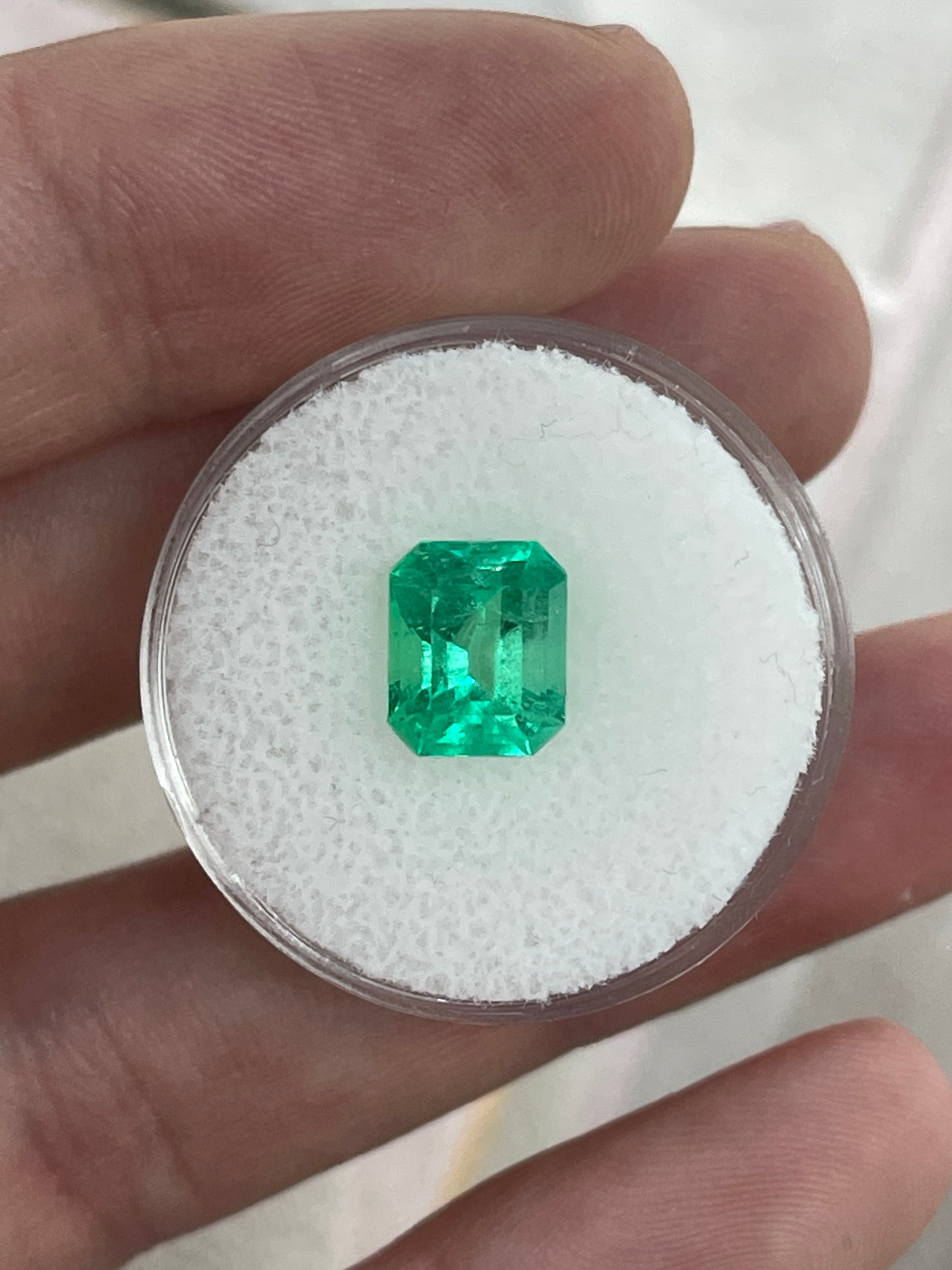 2.47 carat yellowish-green Colombian emerald loose gemstone, emerald cut, natural and radiant from JR Colombian Emeralds