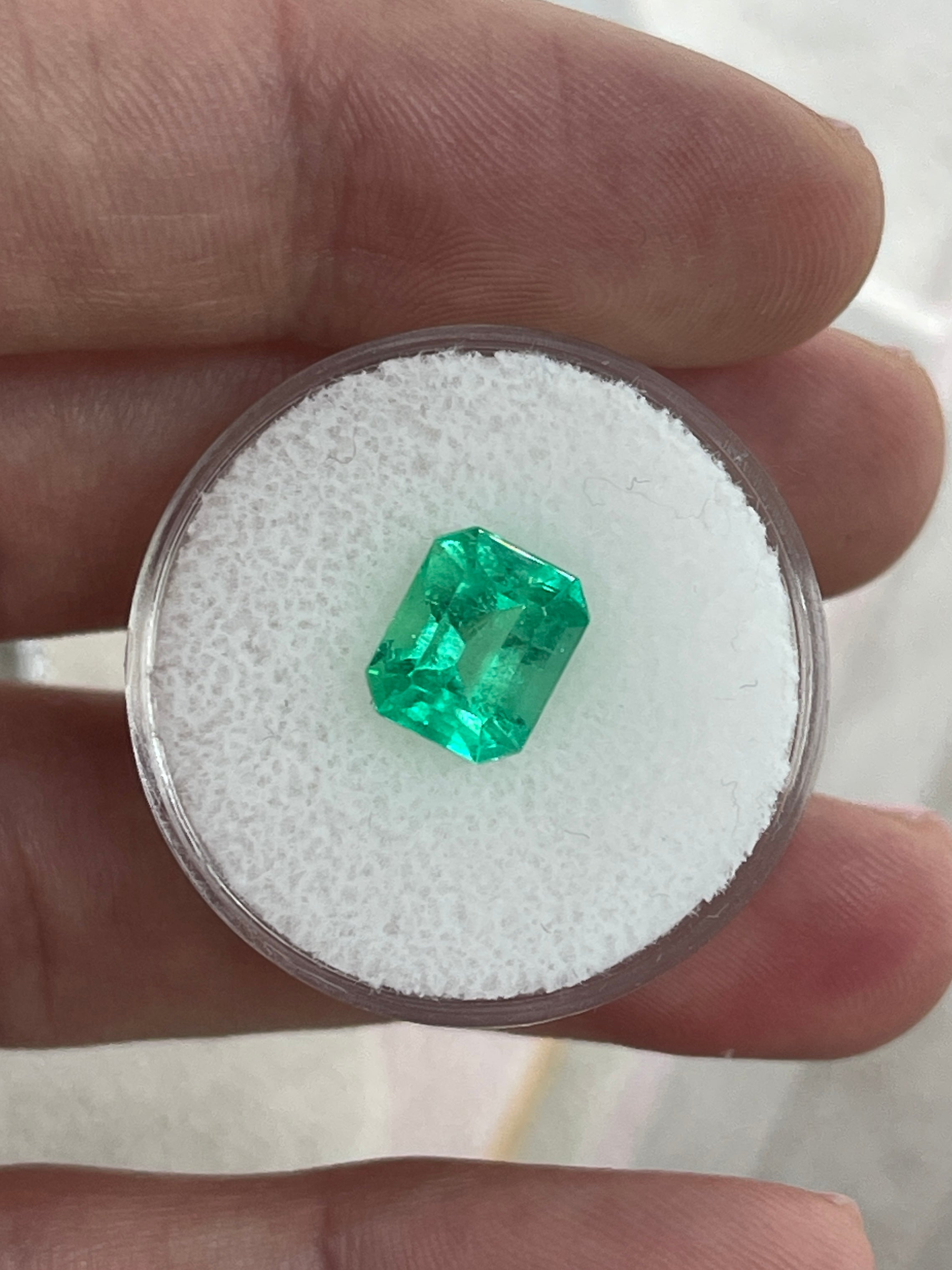 2.47 carat yellowish green natural Colombian emerald loose gemstone in emerald cut, from JR Colombian Emeralds.