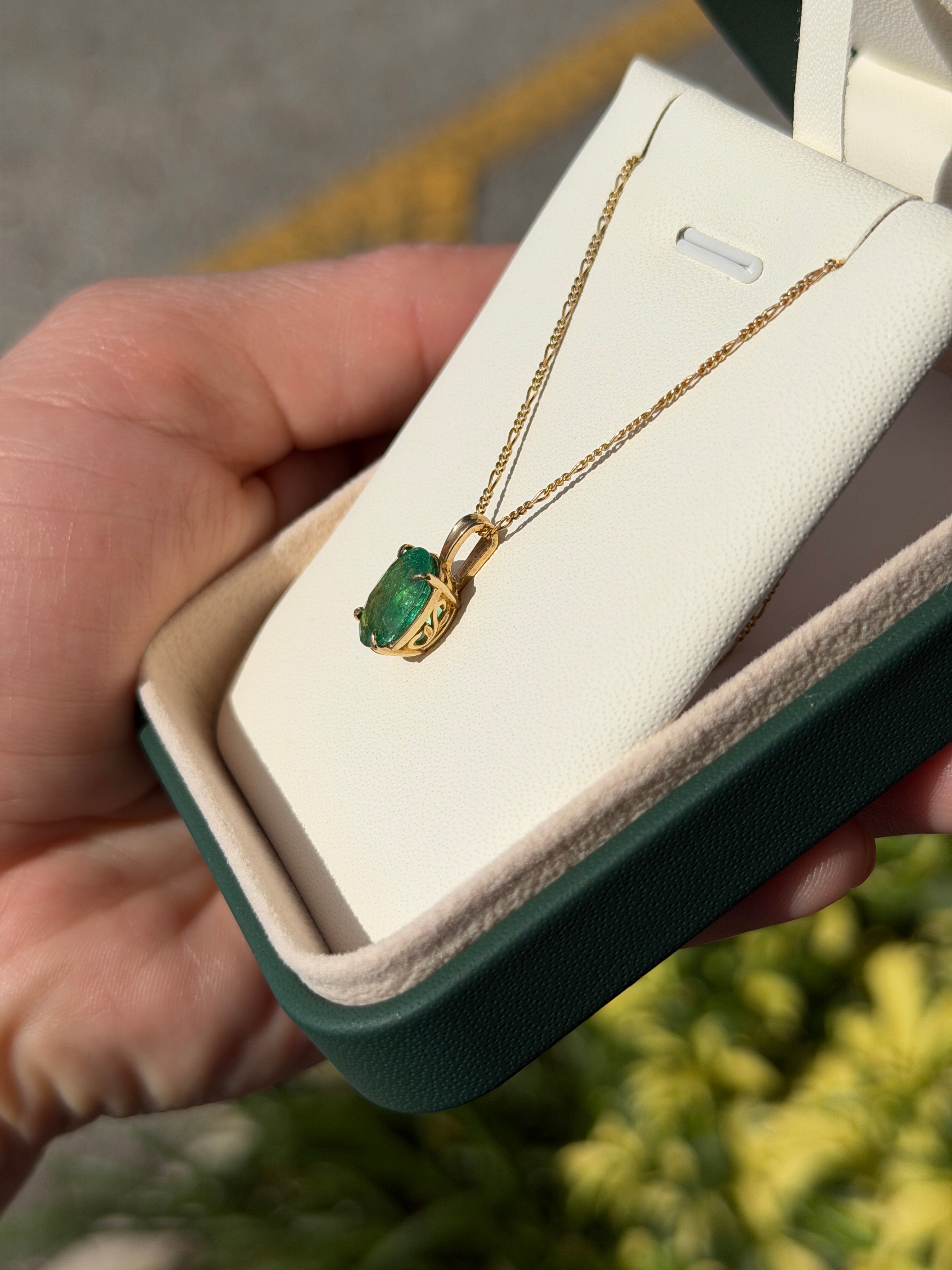 Oval 2.50 carat natural emerald solitaire pendant in 14K gold, showcasing a vibrant green emerald from JR Colombian Emeralds.