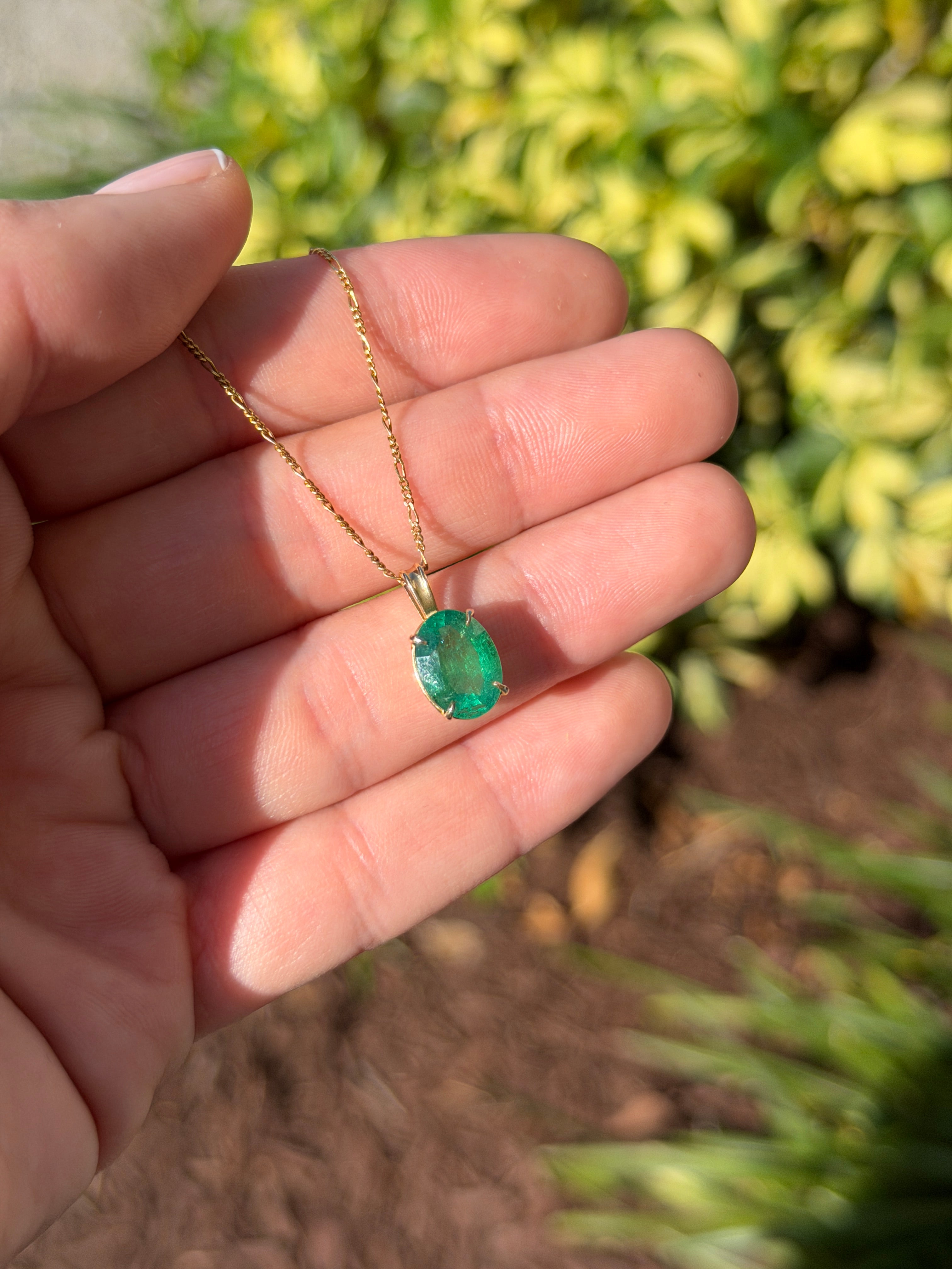 Oval 2.50 carat natural emerald solitaire pendant in 14K gold, featuring a vibrant green emerald from JR Colombian Emeralds.
