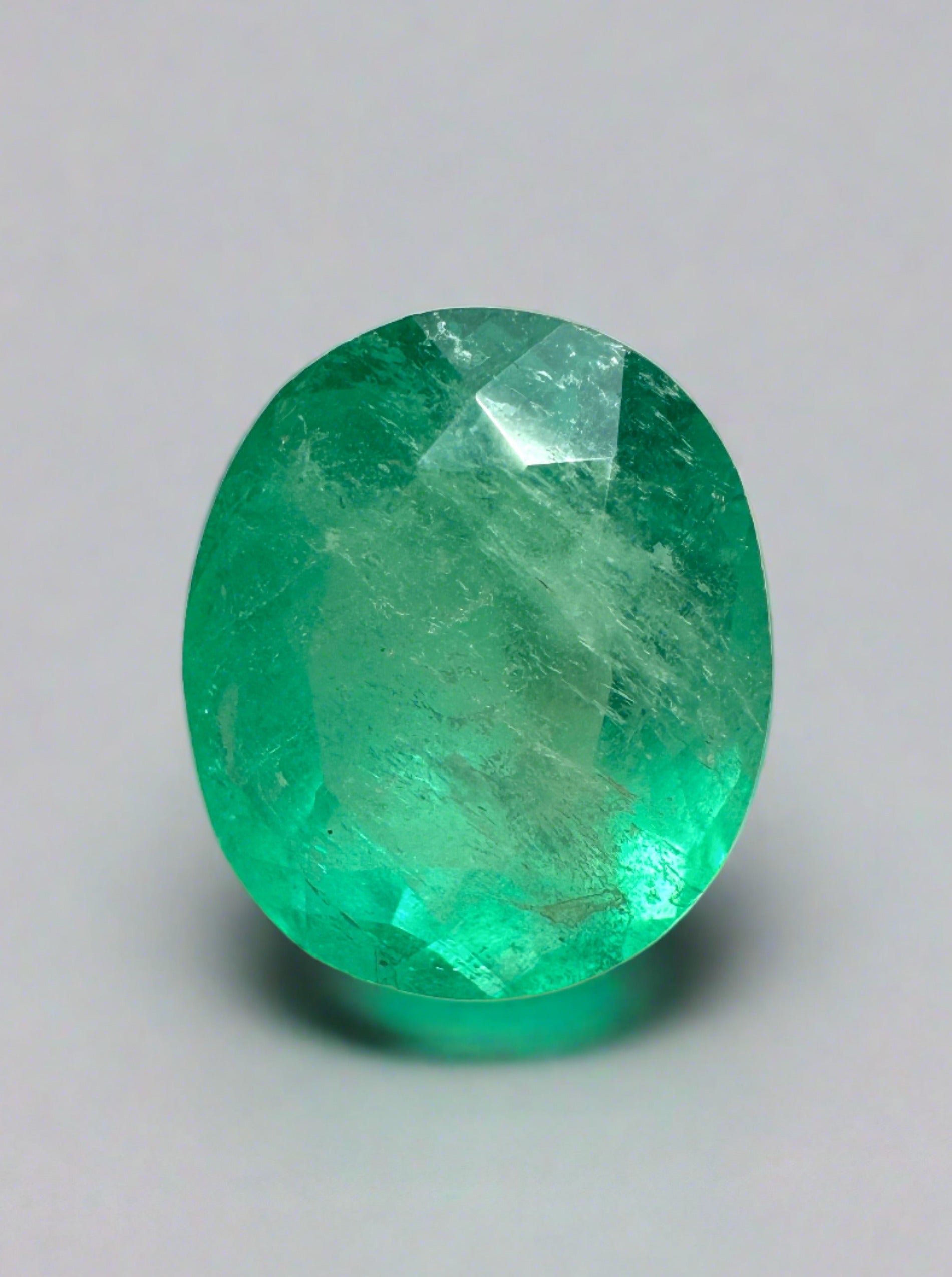 Loose 2.53 carat oval cut green Colombian emerald from JR Colombian Emeralds, natural gemstone with vibrant green color.