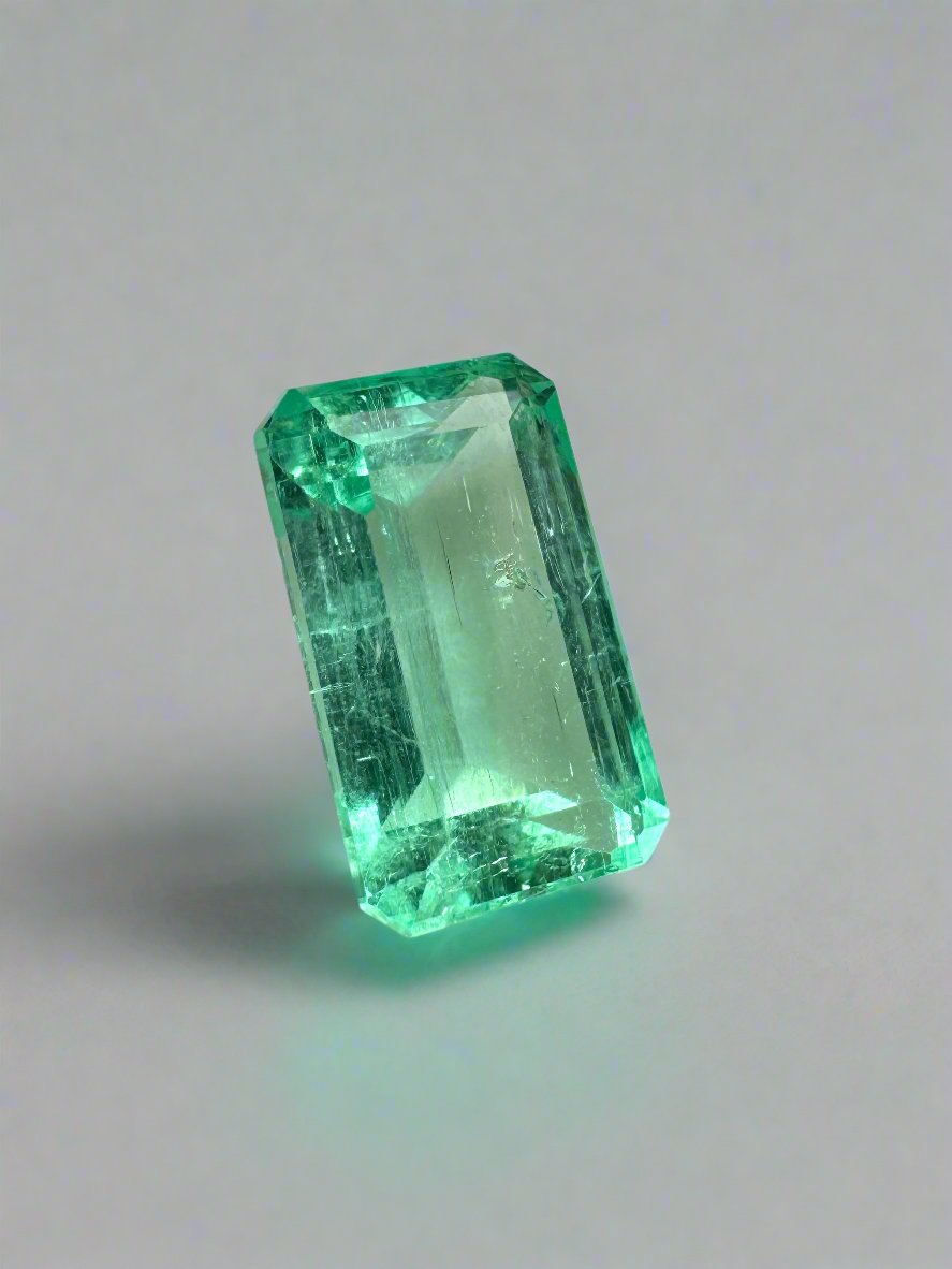 2.64 carat pastel yellowish green Colombian emerald in emerald cut, loose gemstone from JR Colombian Emeralds.