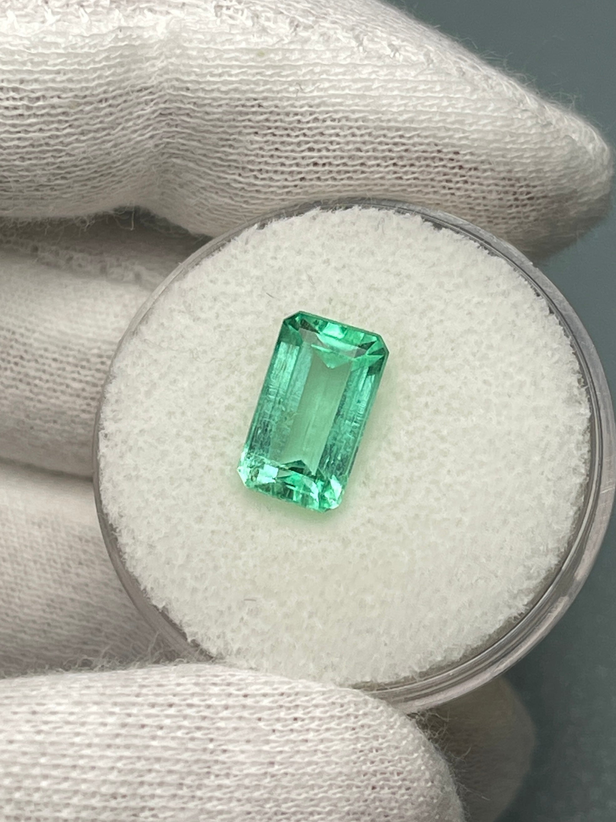 2.64-carat pastel yellowish-green Colombian emerald in an emerald cut, from JR Colombian Emeralds, showcasing its clarity and vibrant color.