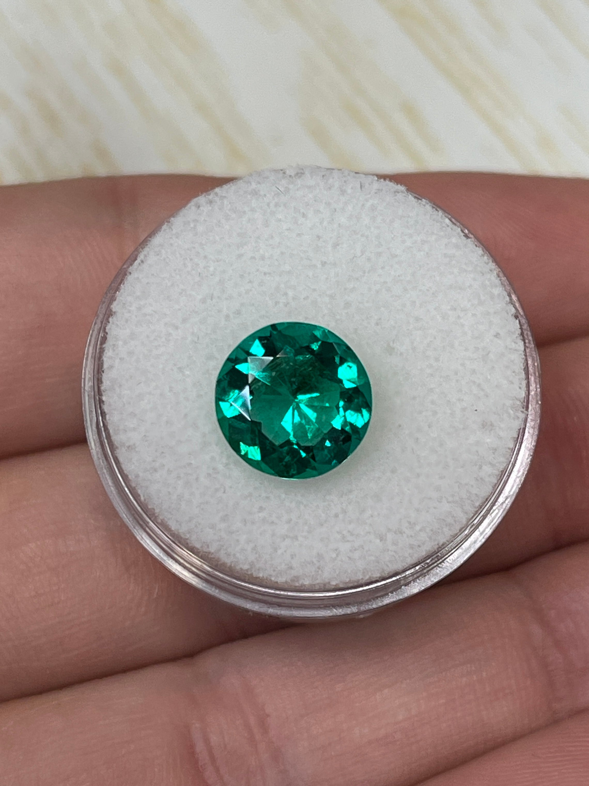 2.71 carat natural Colombian emerald loose gemstone, round cut with AAA+ quality and drop of oil appearance.