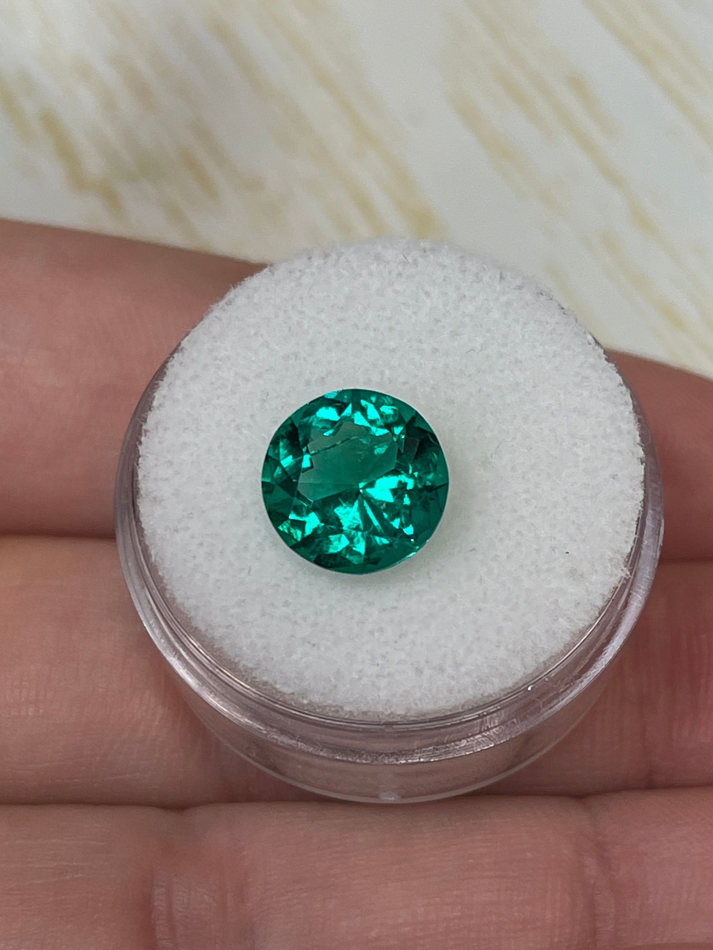 2.71 carat natural Colombian emerald loose gemstone, round cut with AAA+ clarity and oil-like luster, from JR Colombian Emeralds.