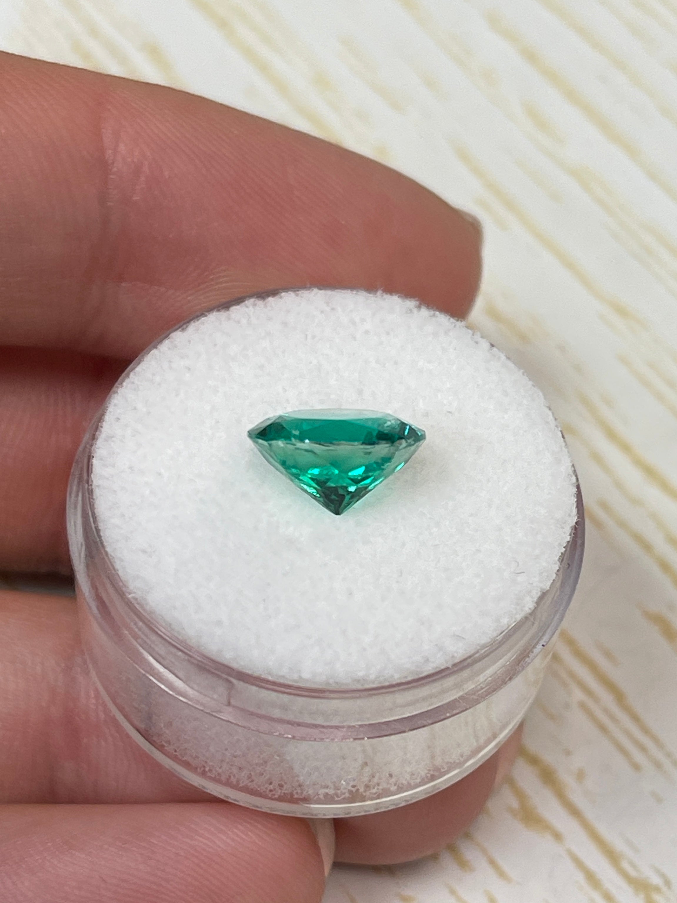 2.71 Carat natural Colombian Emerald loose gemstone, round cut with AAA+ clarity and oil-like surface finish.
