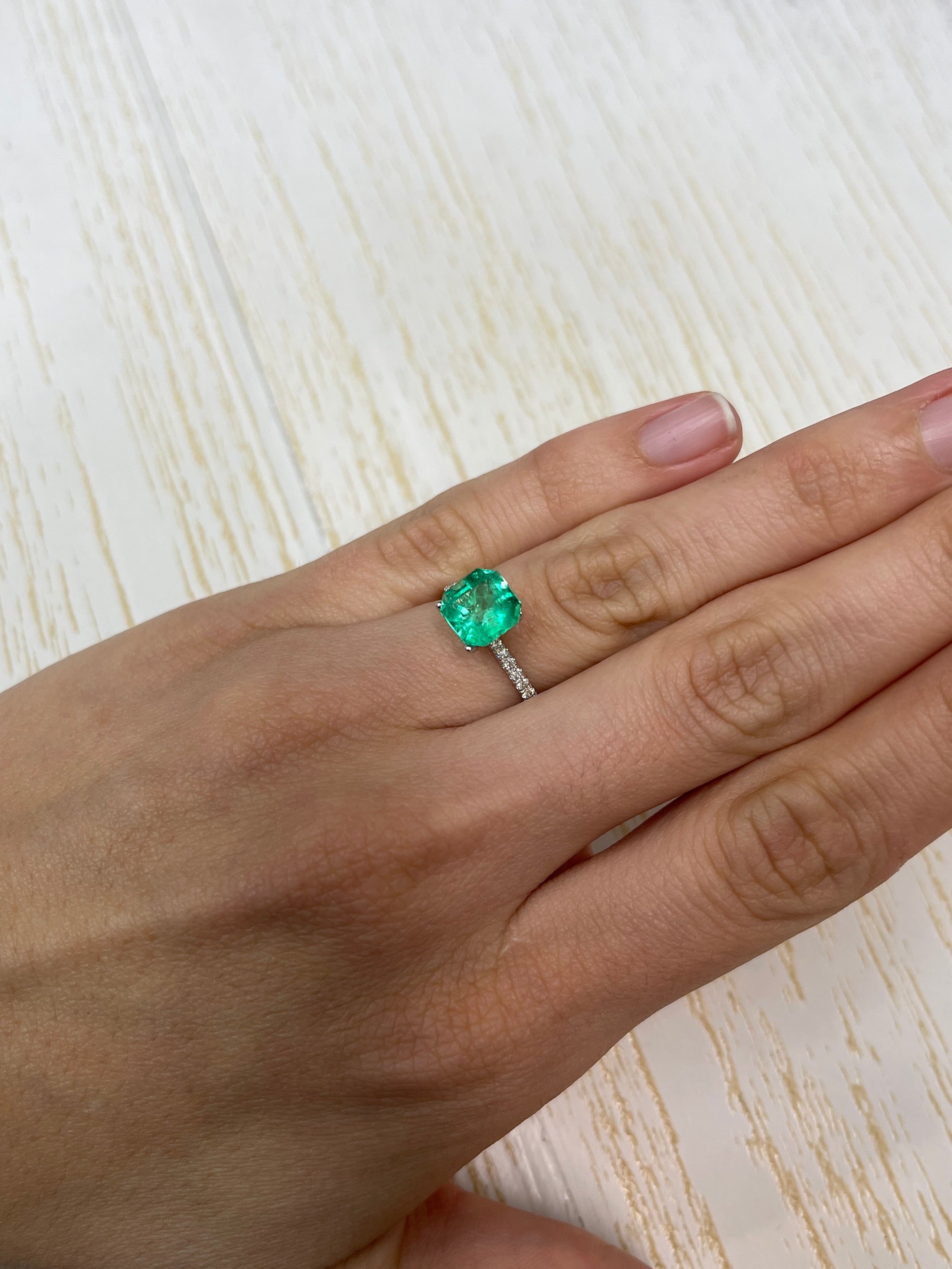 2.71 carat electric yellowish green natural Colombian emerald loose Asscher cut, showcasing clarity and vibrant color from JR Colombian Emeralds