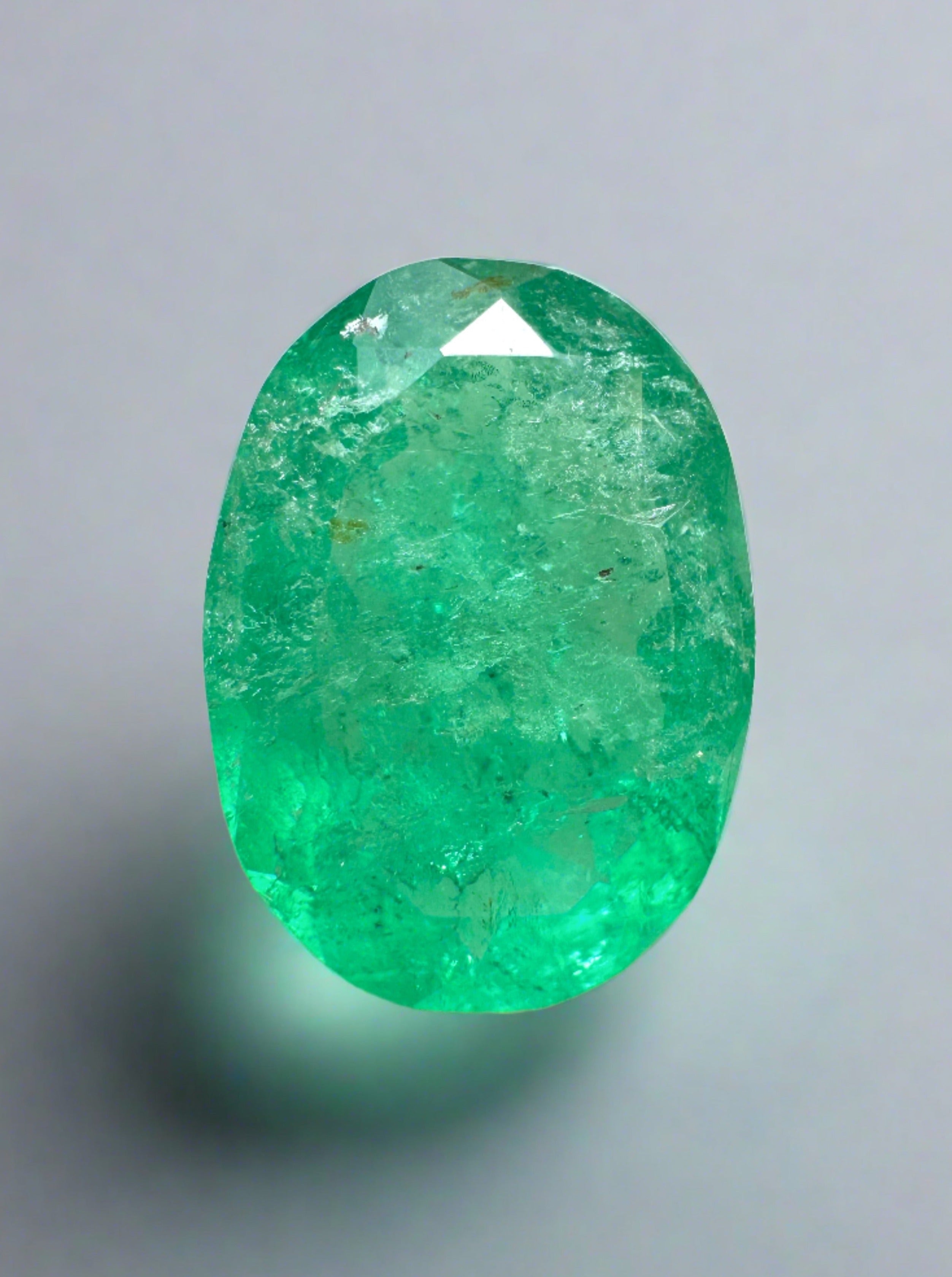 2.72 Carat earthy green natural Colombian emerald loose gemstone with oval cut, showcasing vibrant green color and clarity.