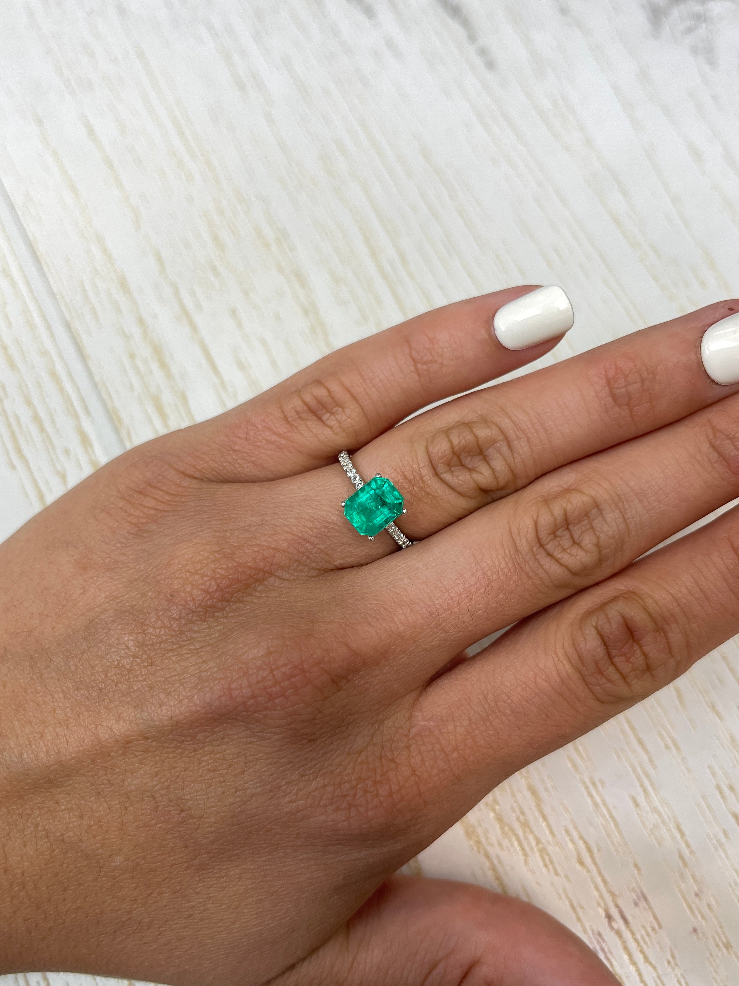 2.73 Carat bluish green natural Colombian emerald loose gemstone in an emerald cut, showcasing fine color and clarity.