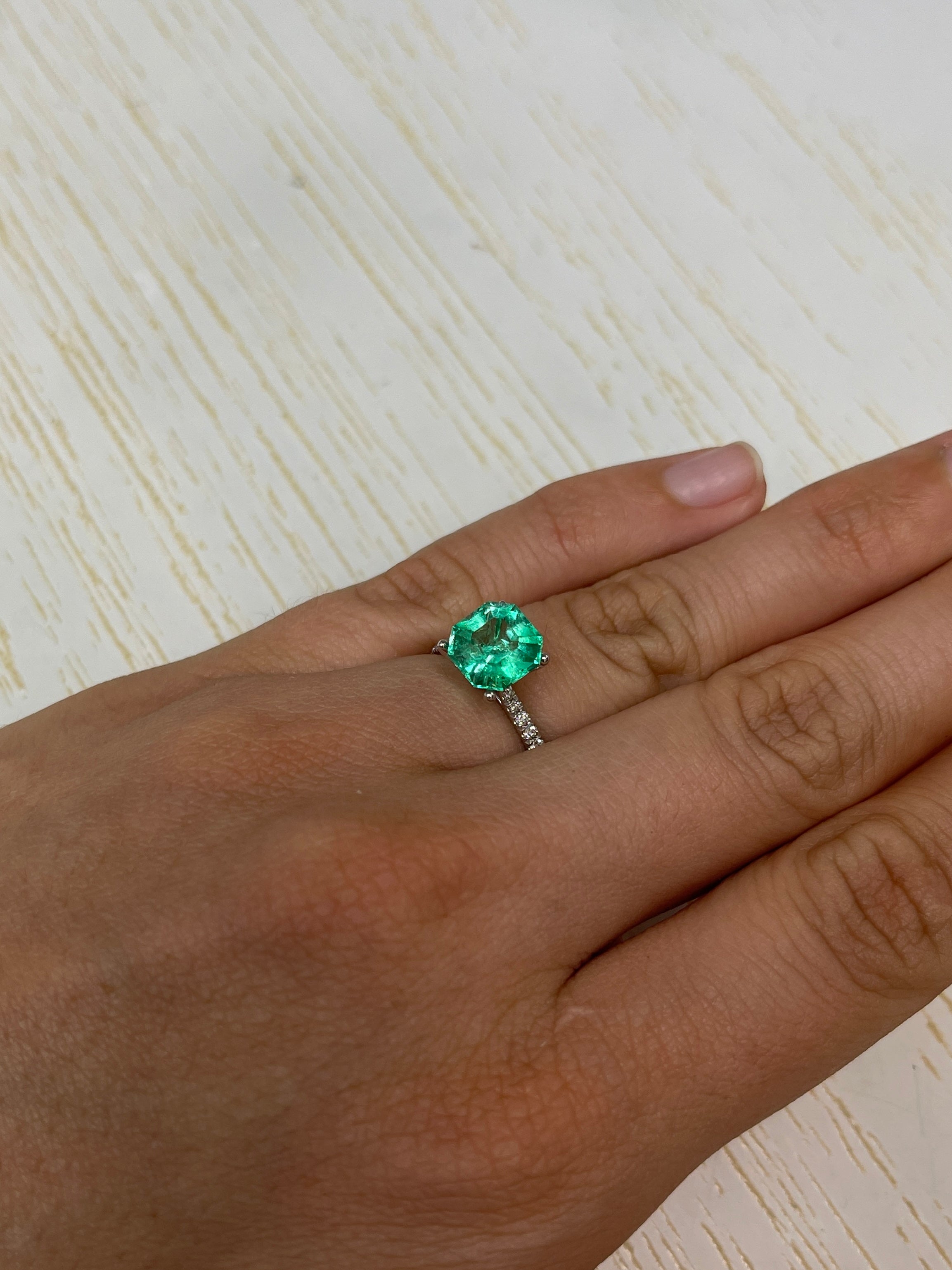 2.76 Carat vivacious natural loose Colombian emerald Asscher cut with clipped corners, showcasing vibrant green color and clarity.