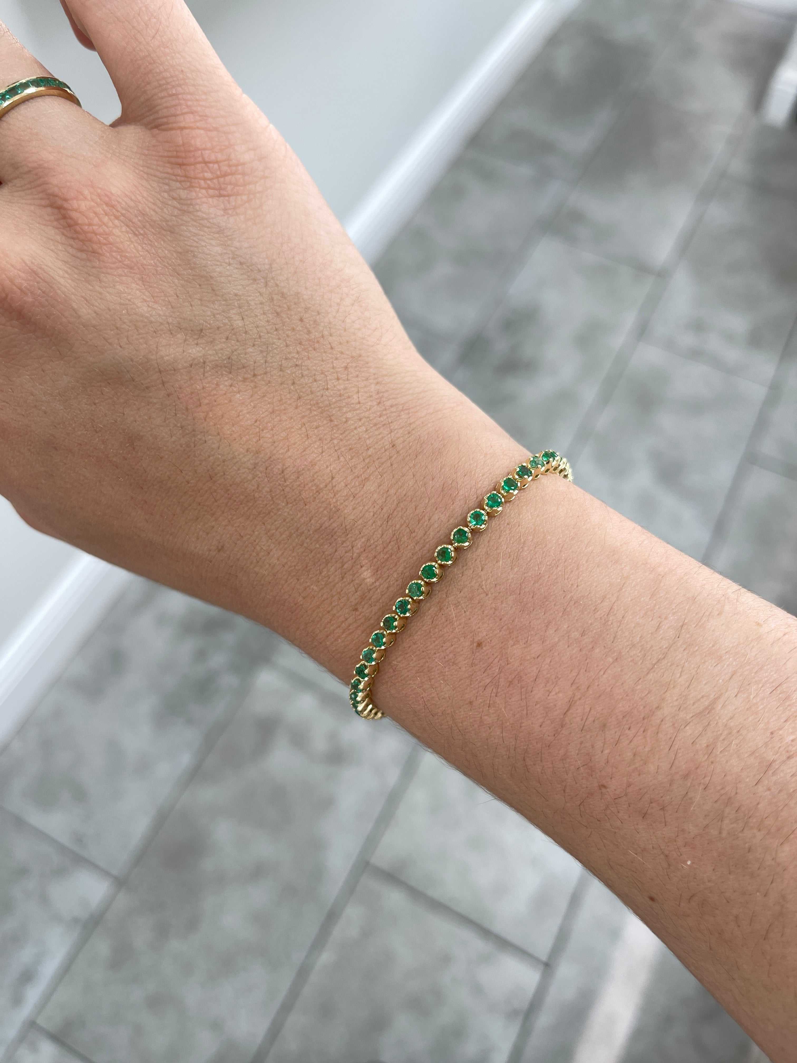 Medium green natural round emerald tennis bracelet by JR Colombian Emeralds, 14K gold, 7-inch length, 2.76 carats total weight.