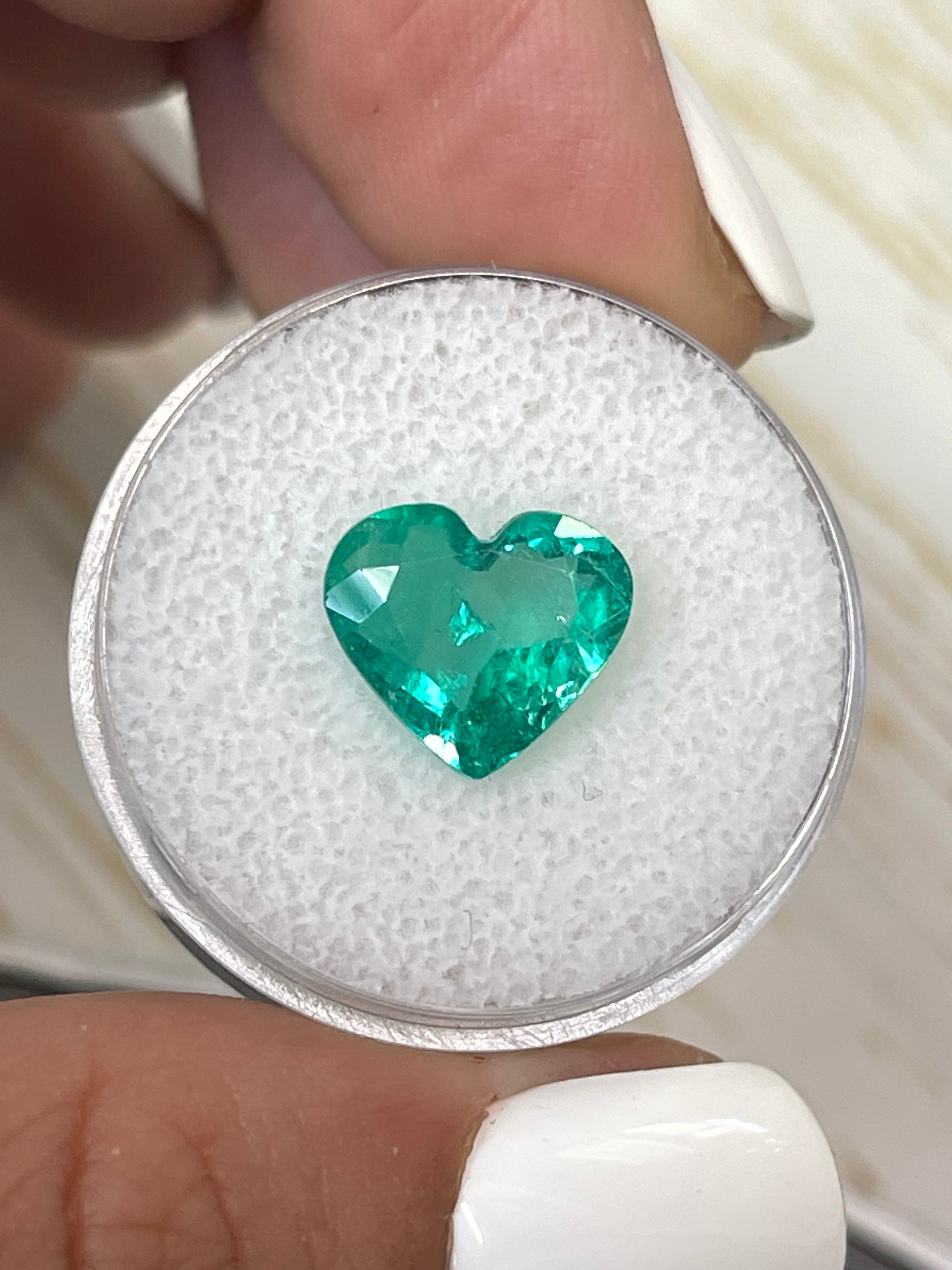 Bright green 2.84 carat natural Colombian emerald in heart cut, loose gemstone by JR Colombian Emeralds.