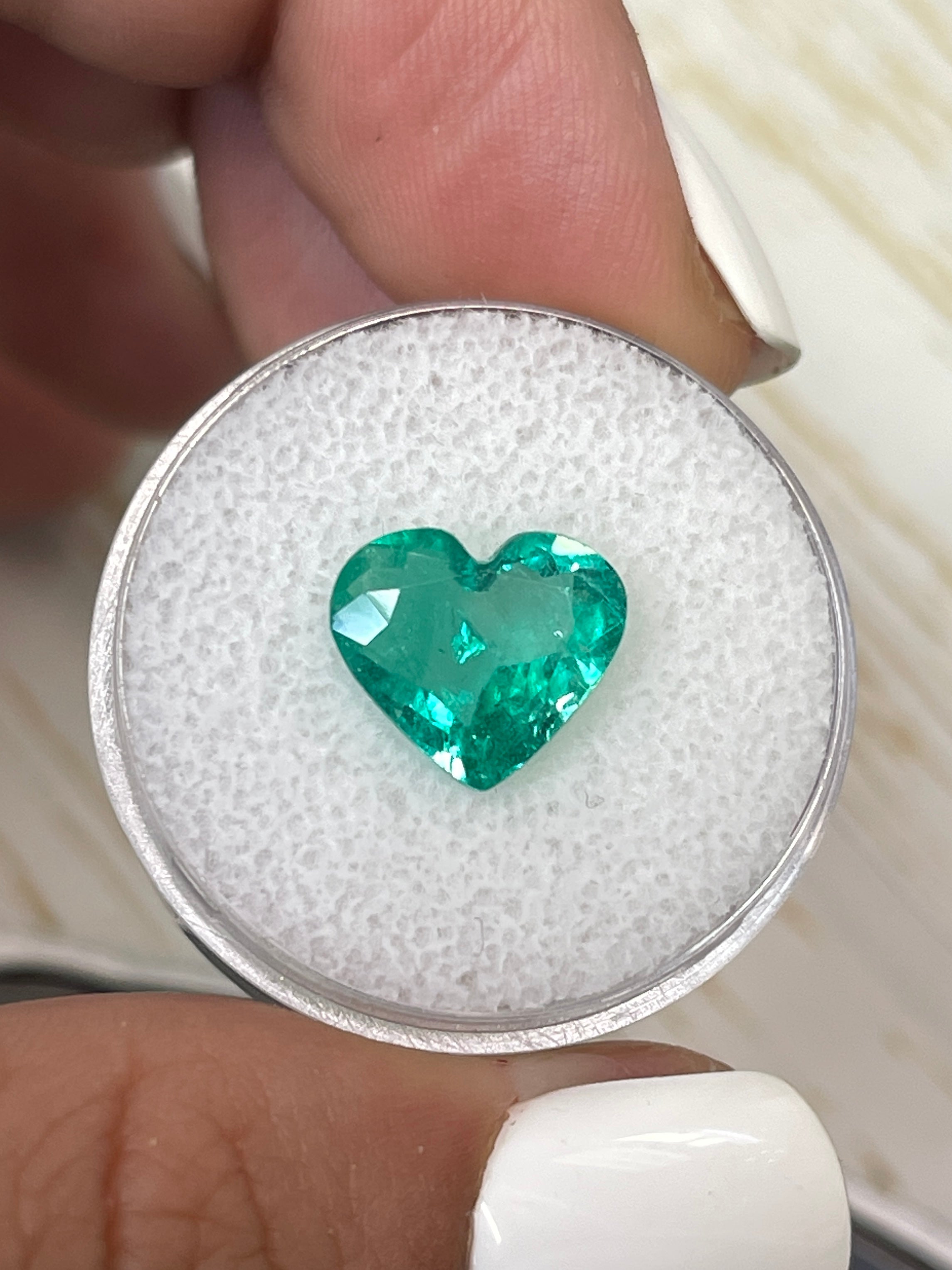Bright green 2.84 carat natural Colombian emerald in heart cut, loose gemstone from JR Colombian Emeralds.