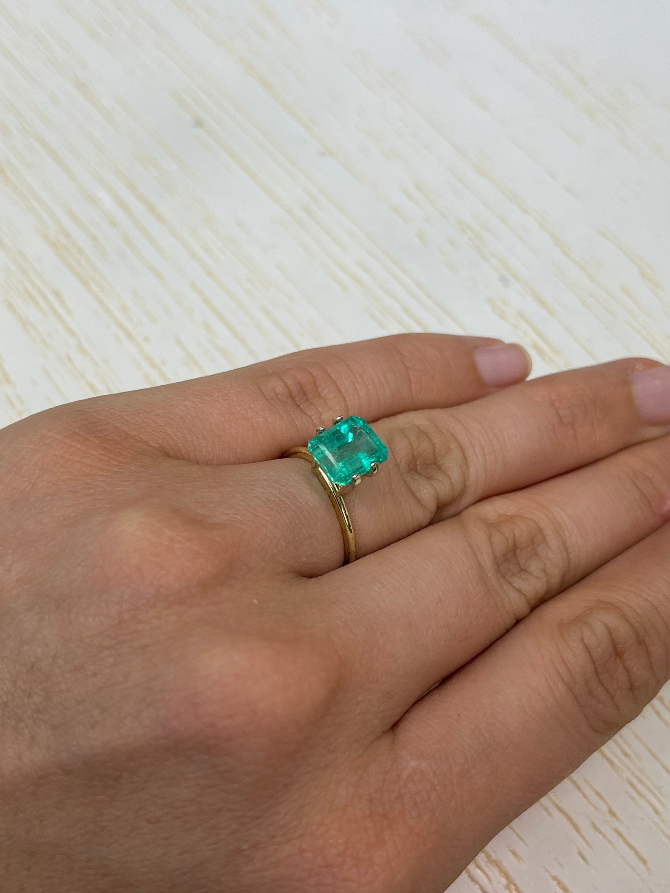 2.84 carat natural Colombian emerald loose gemstone with an emerald cut, showcasing vibrant green color and chunky shape.
