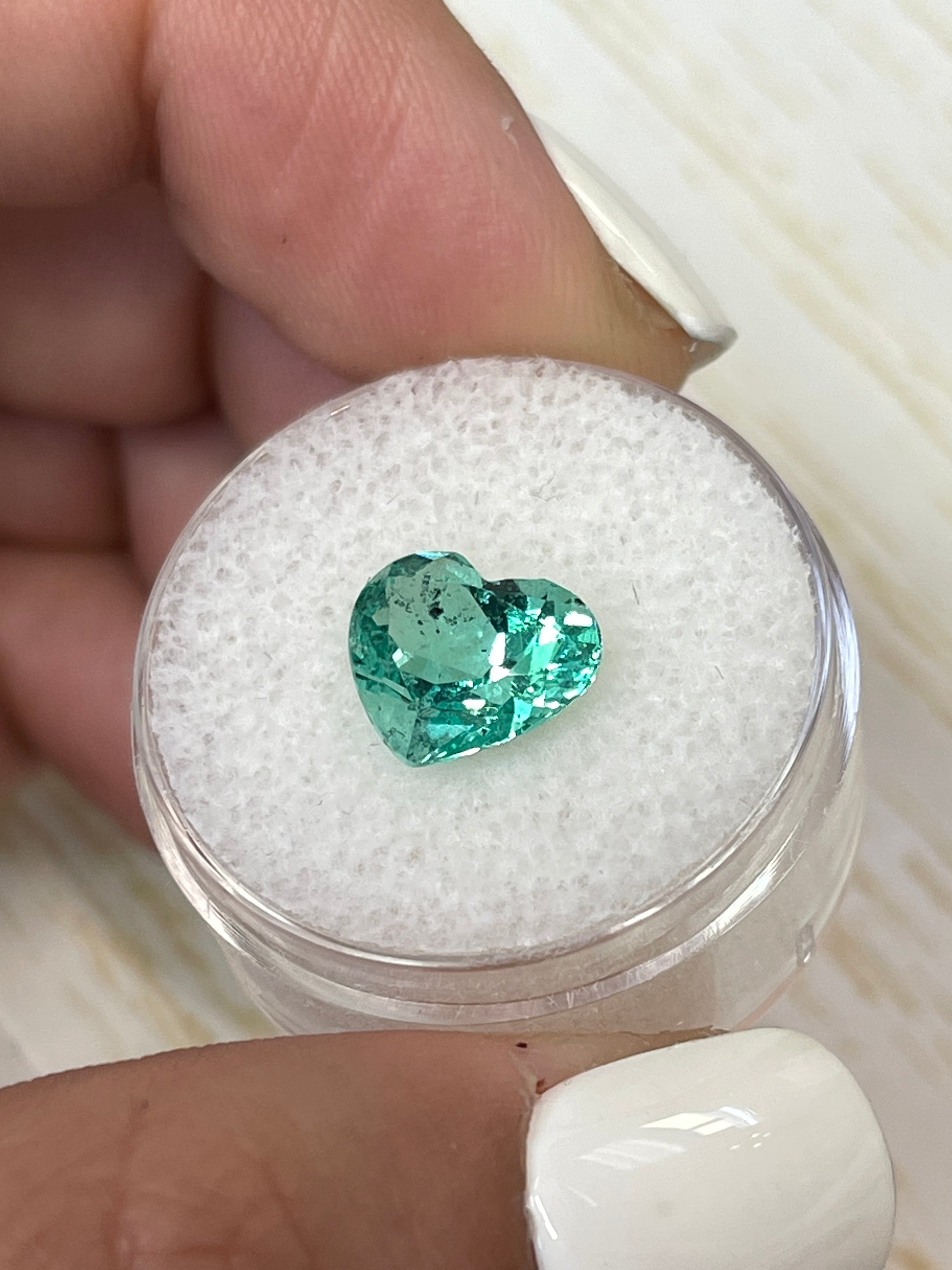 Lustrous 2.87 Carat natural Colombian emerald loose gemstone, 9x11mm heart cut with vibrant green color by JR Colombian Emeralds.