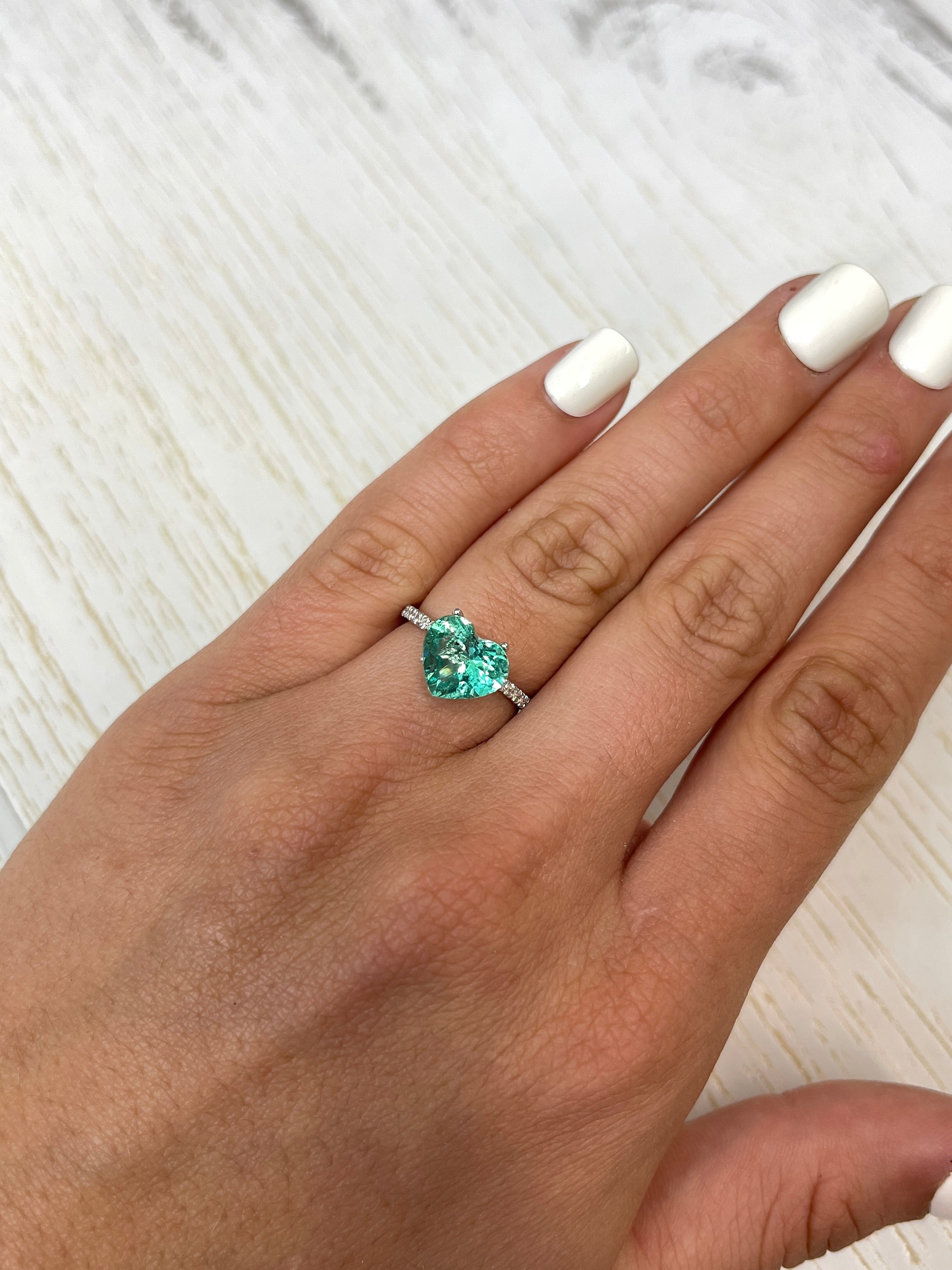Lustrous 2.87 carat natural Colombian emerald in heart cut, showcasing vibrant green color and clarity, from JR Colombian Emeralds.