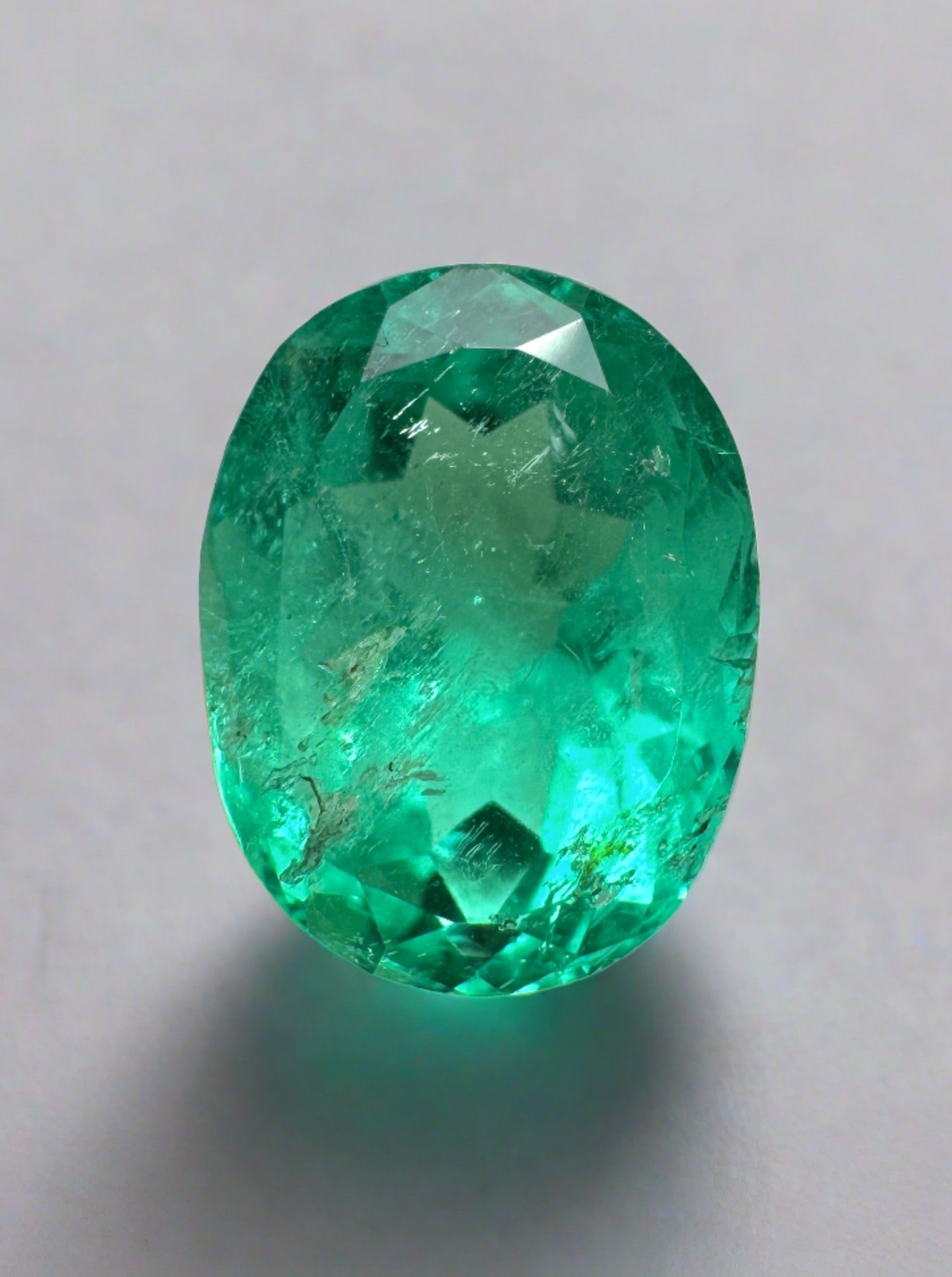 Bluish green 2.90 carat natural Colombian emerald in oval cut, loose gemstone, showcasing rich color and clarity.