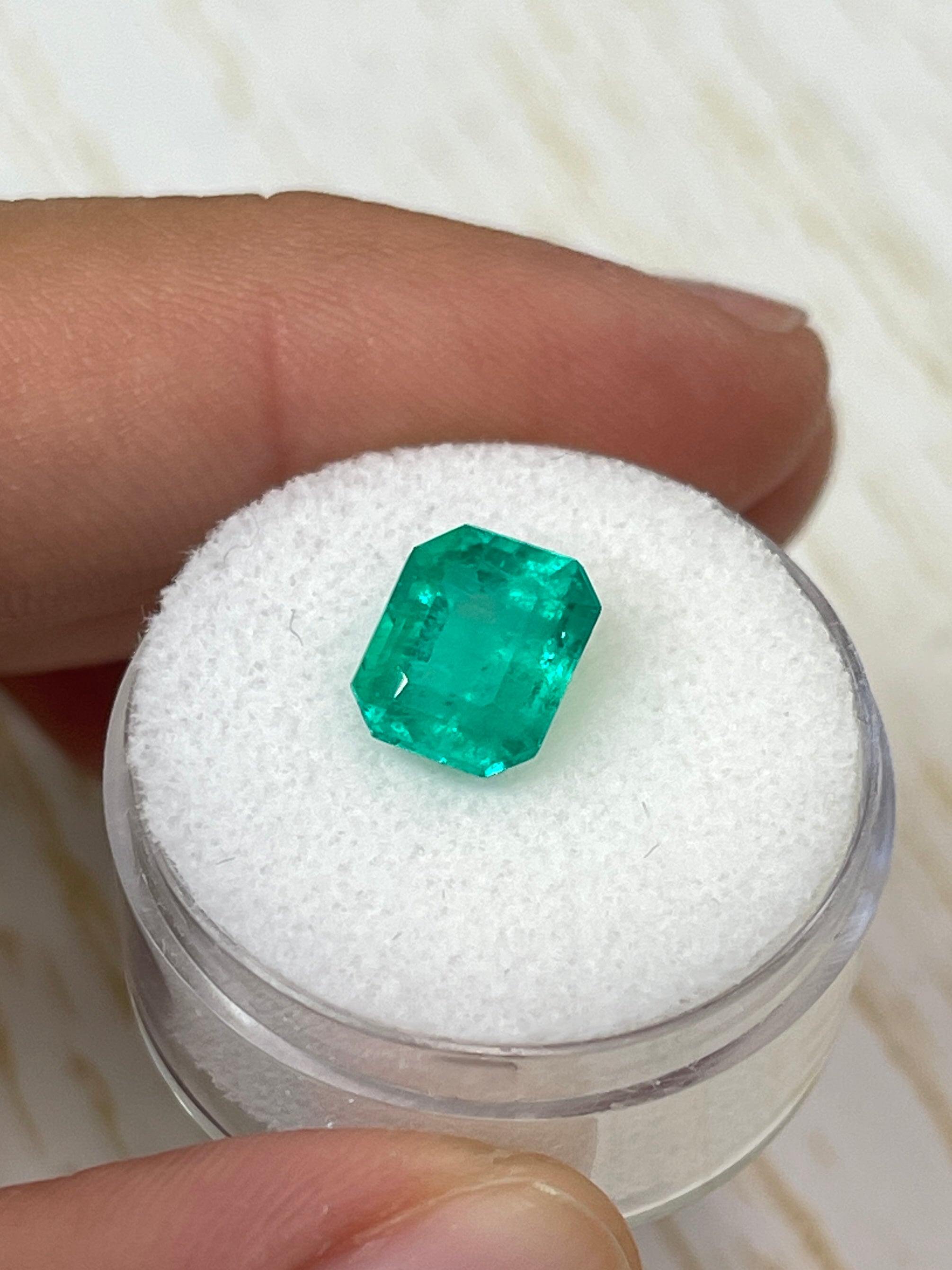 2.93 carat natural Colombian emerald loose gemstone in an emerald cut, showcasing vibrant green color and clarity.