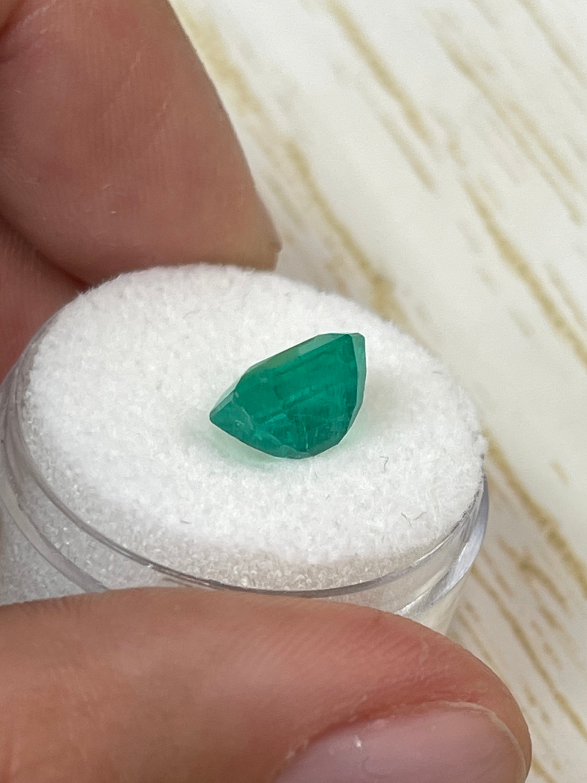 2.93 carat natural Colombian emerald loose gemstone in an emerald cut, showcasing vibrant green color and clarity.