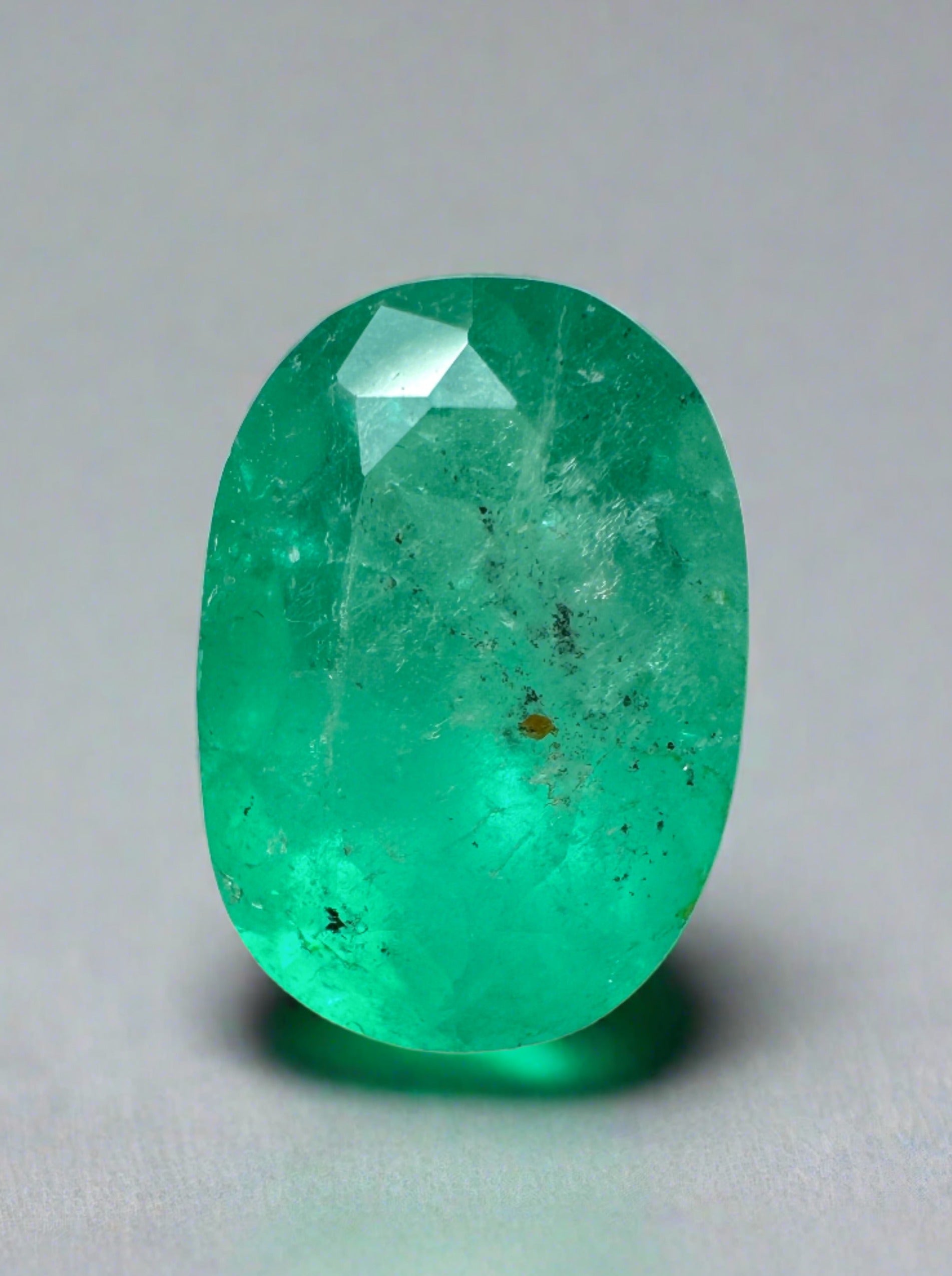 Freckled medium green Colombian emerald loose oval cut, 2.95 carats, 11.3x8mm, from JR Colombian Emeralds.
