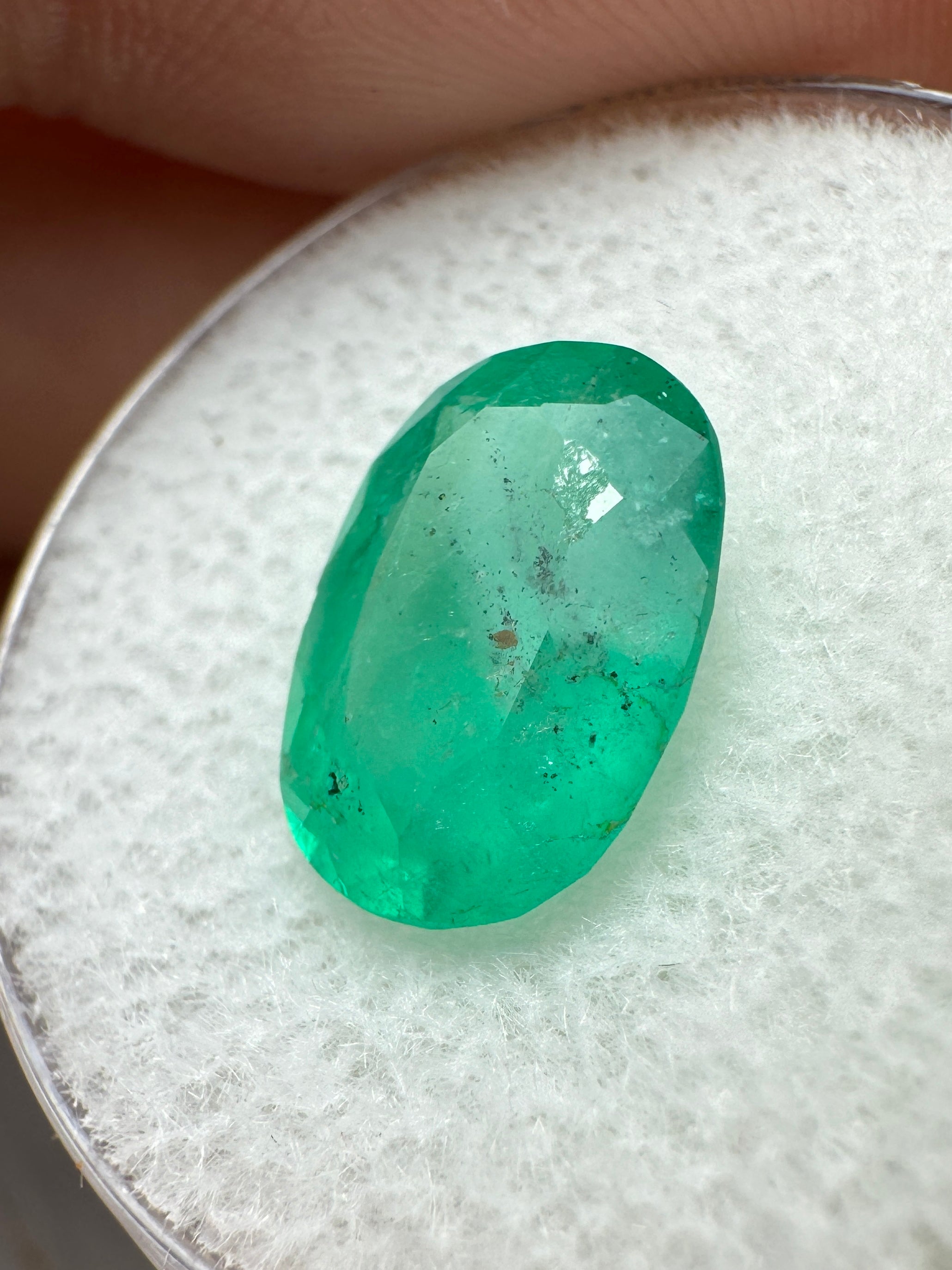 Freckled medium green Colombian emerald, 2.95 carats, oval cut, loose gemstone from JR Colombian Emeralds.