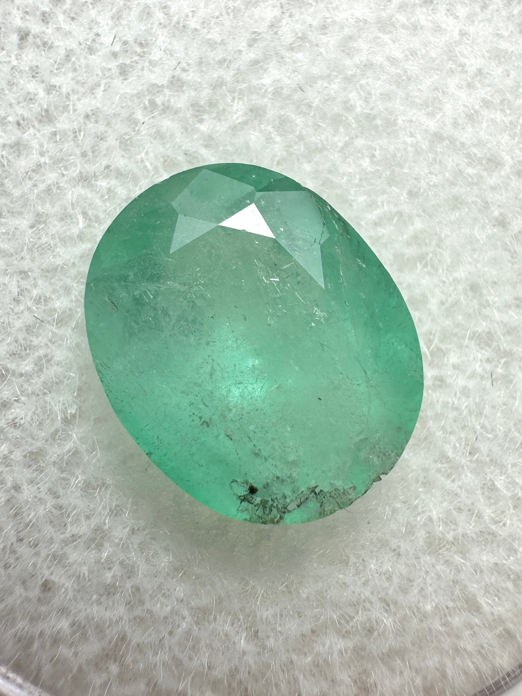 2.95 carat pastel mint green Colombian emerald loose oval cut gemstone by JR Colombian Emeralds. Natural and vibrant.