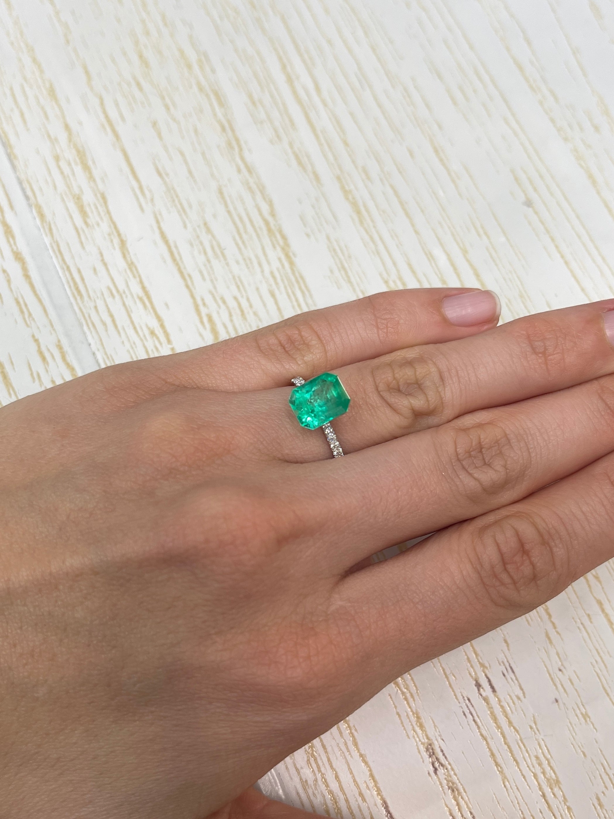 Electric yellowish 3.09 carat Colombian emerald in 10x8 emerald cut, from JR Colombian Emeralds.