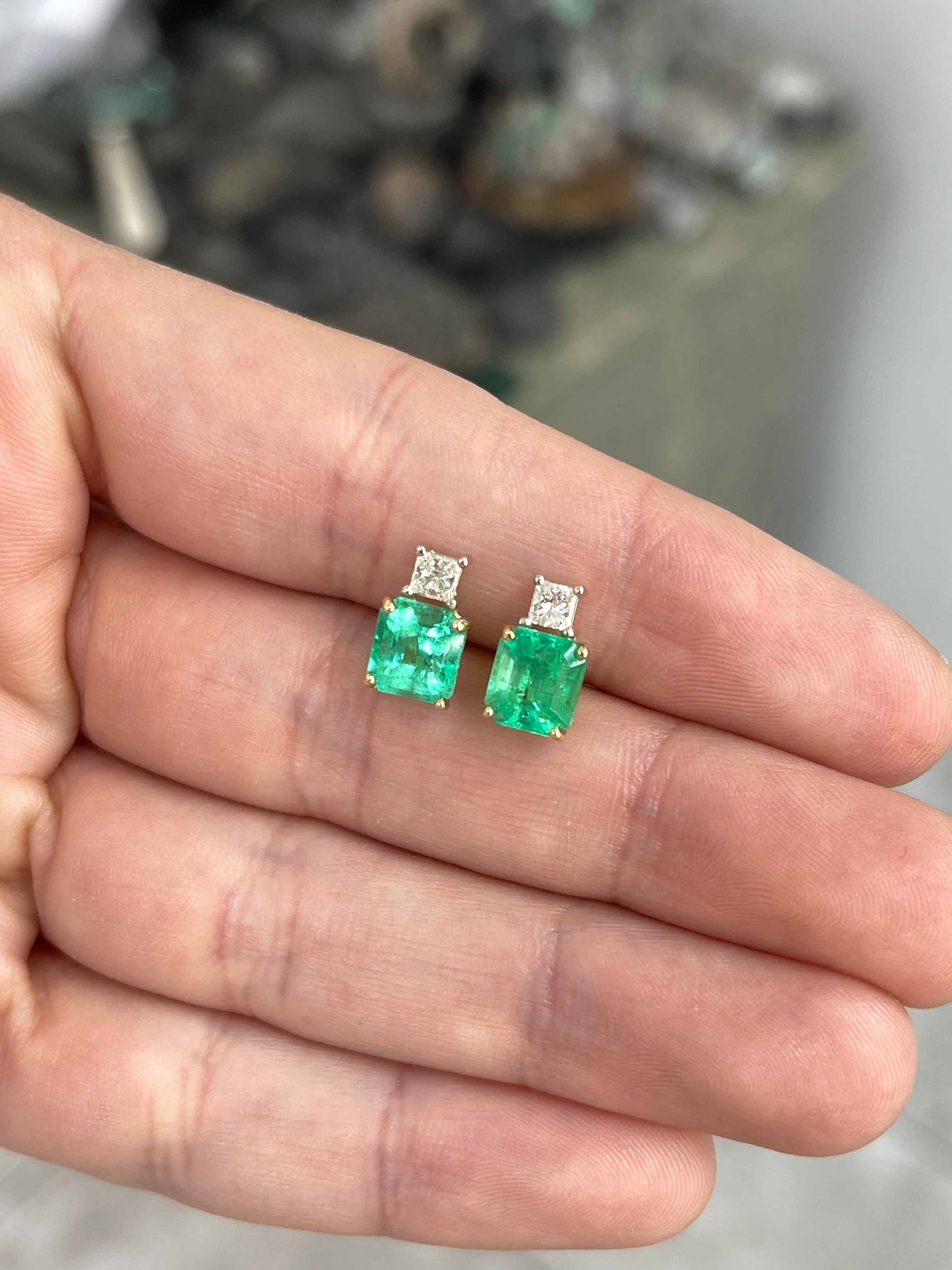 Colombian emerald and princess cut diamond earrings in 18K two-toned gold, featuring 3.10 carats total weight.