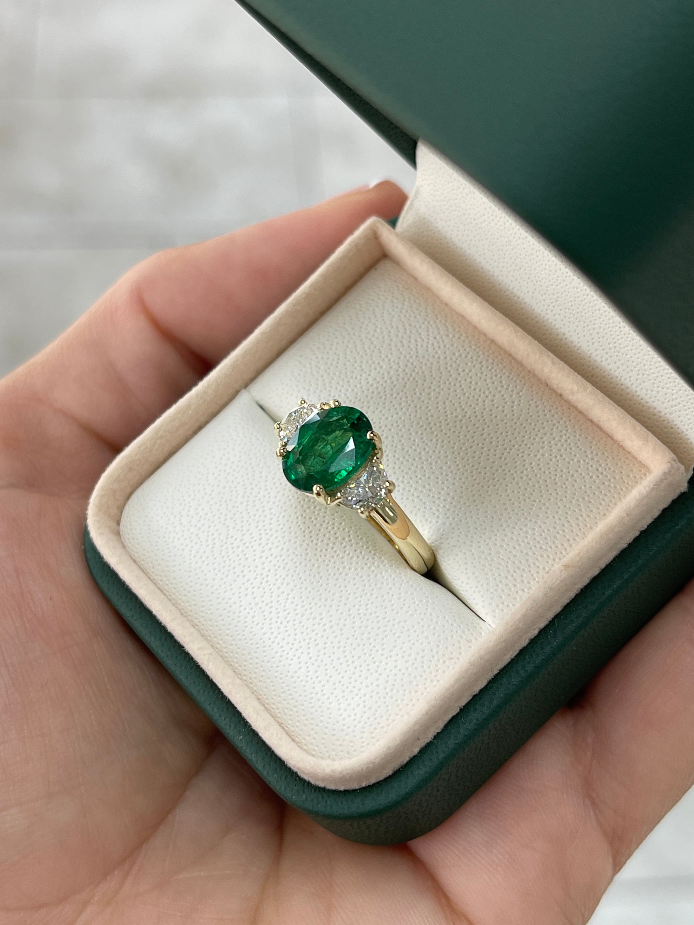 14K gold three stone ring featuring a 3.10tcw natural oval emerald and half moon lab diamond from JR Colombian Emeralds.