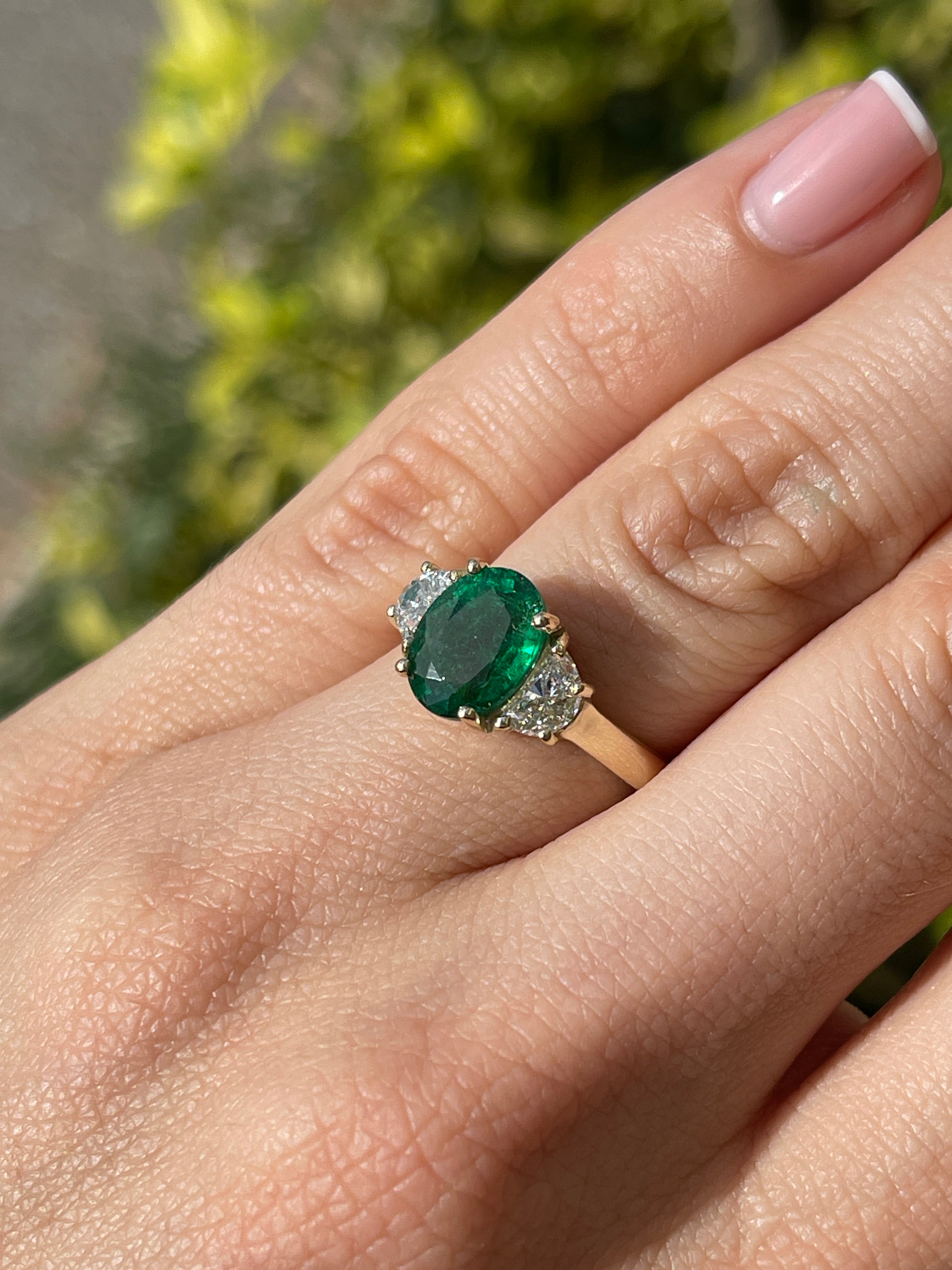 14K gold three stone ring featuring a natural oval emerald and half moon lab diamond, crafted by JR Colombian Emeralds