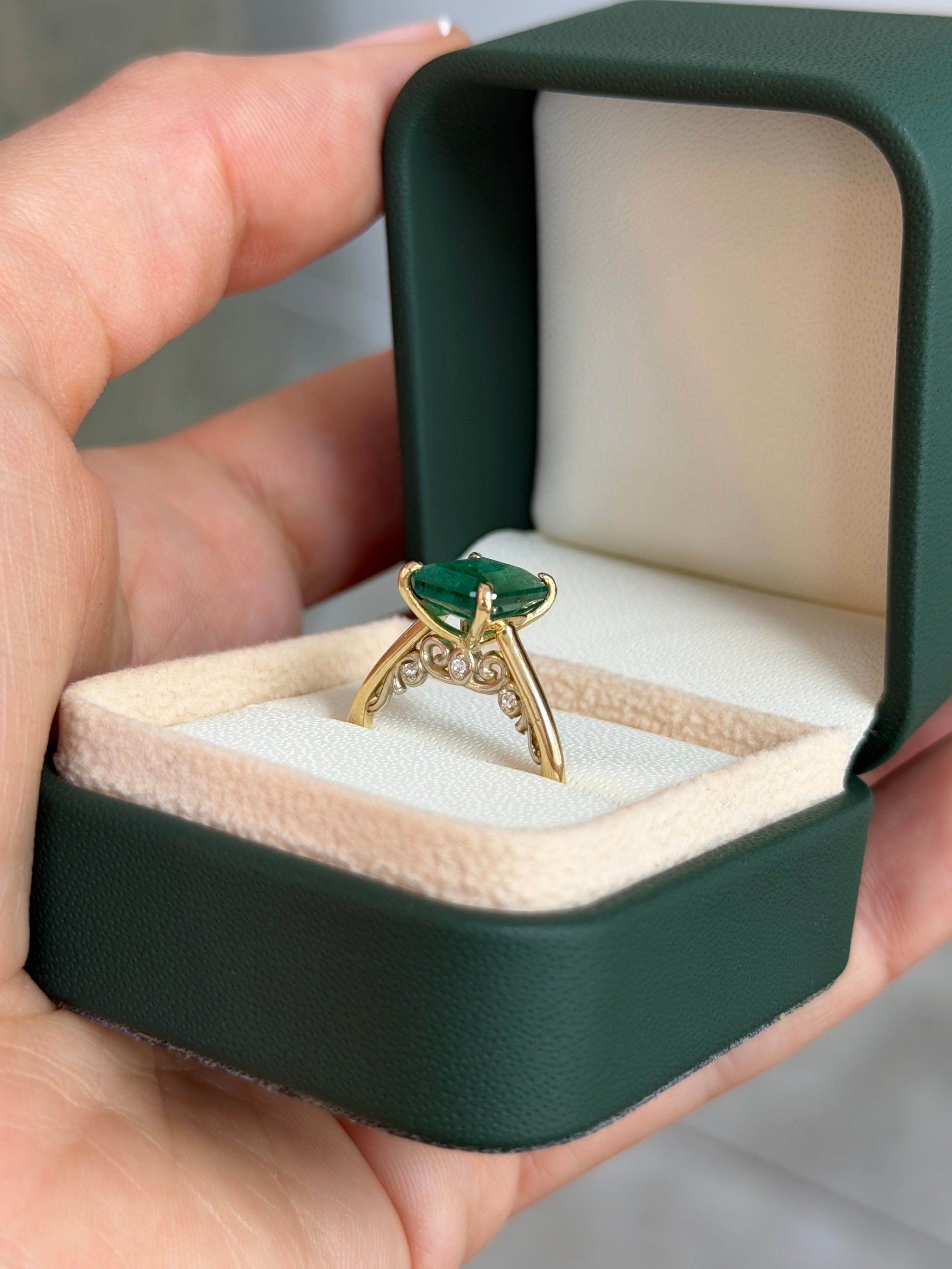 14K gold engagement ring with a 3.20tcw emerald cut emerald and hidden diamond accents, crafted by JR Colombian Emeralds.