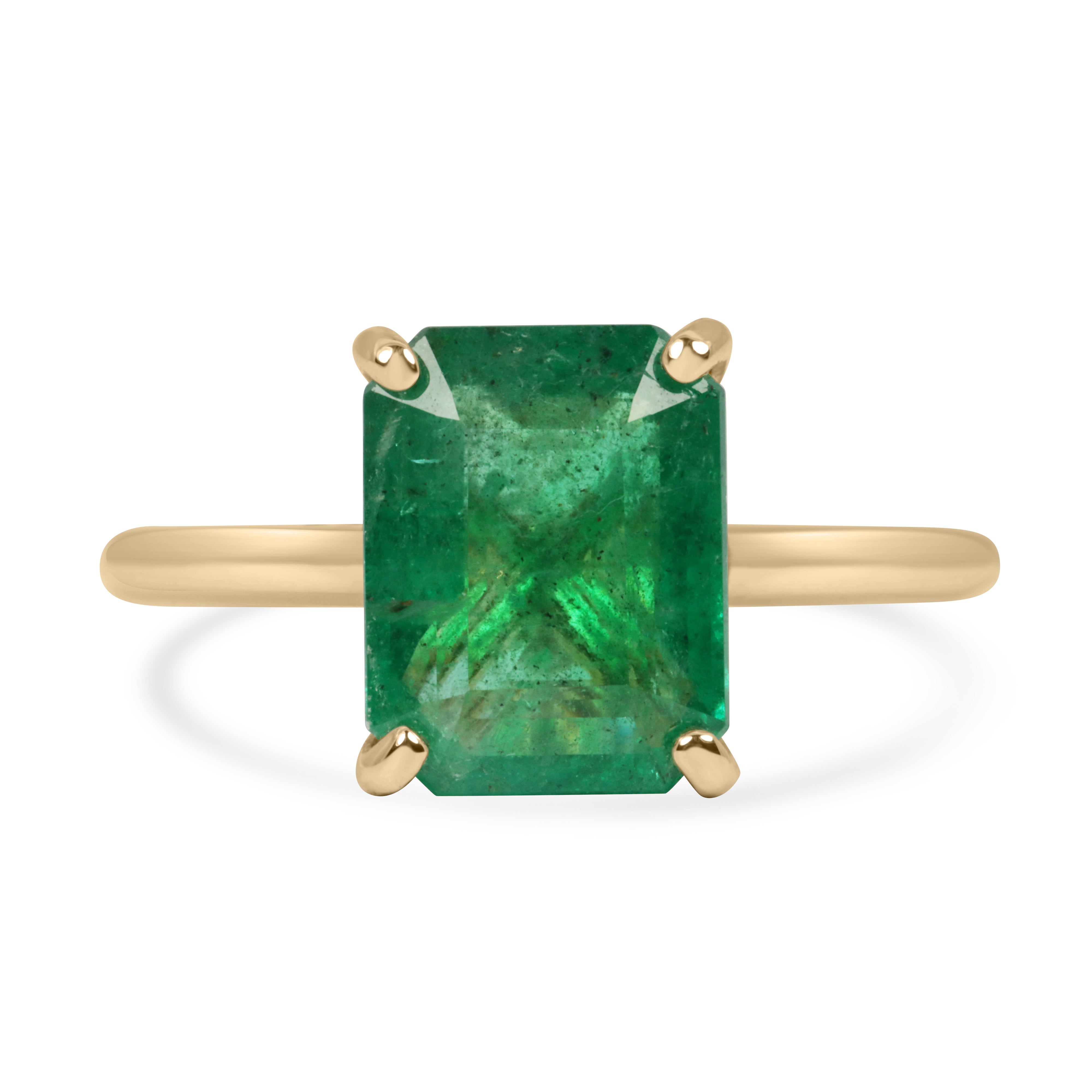 14K gold emerald cut emerald engagement ring with hidden diamonds, featuring a 3.20 tcw center stone and gallery detail.