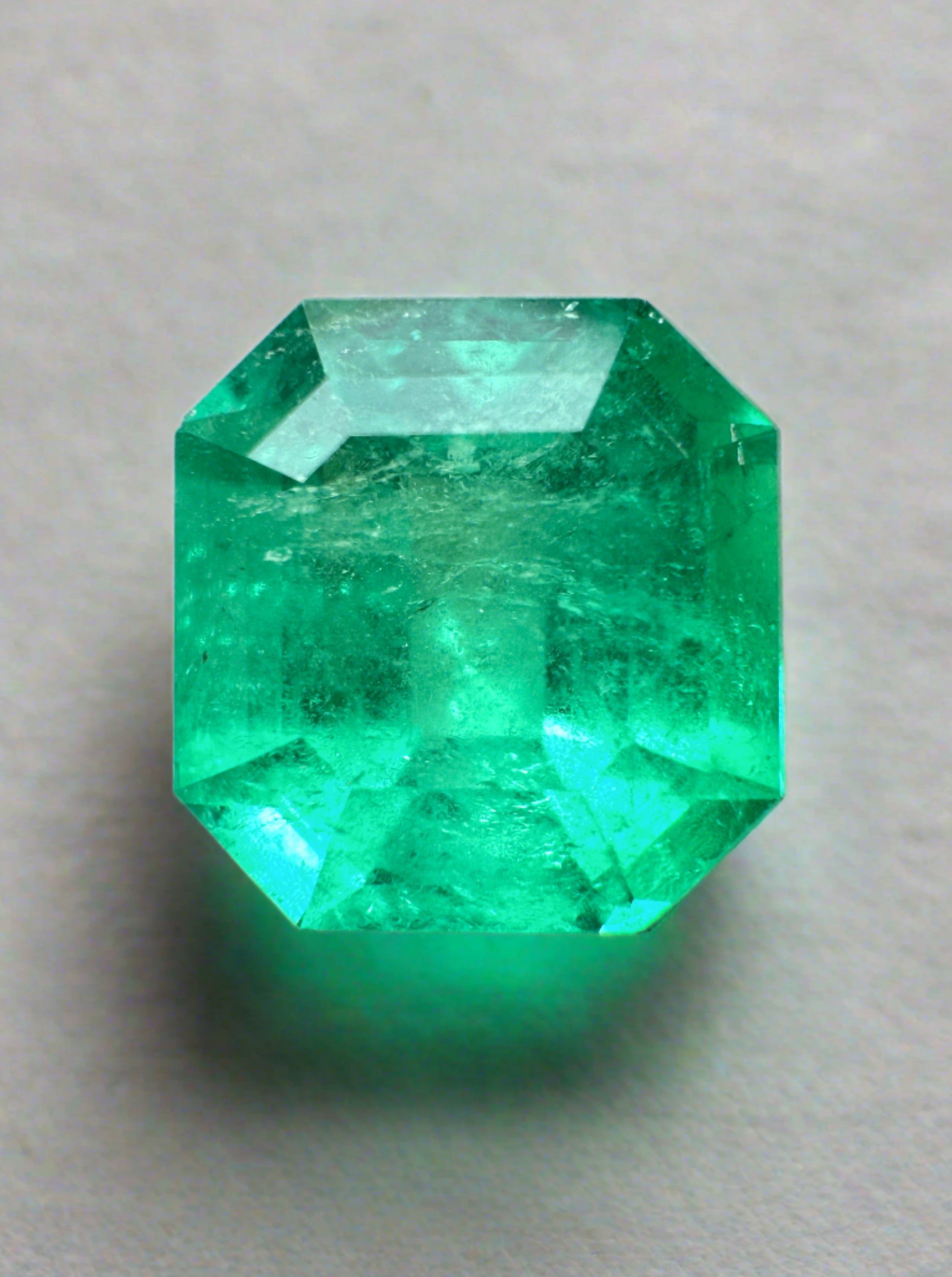 Natural 3.21 Carat 9x9mm yellowish green Colombian emerald loose gemstone in Asscher cut, showcasing vibrant color and clarity.