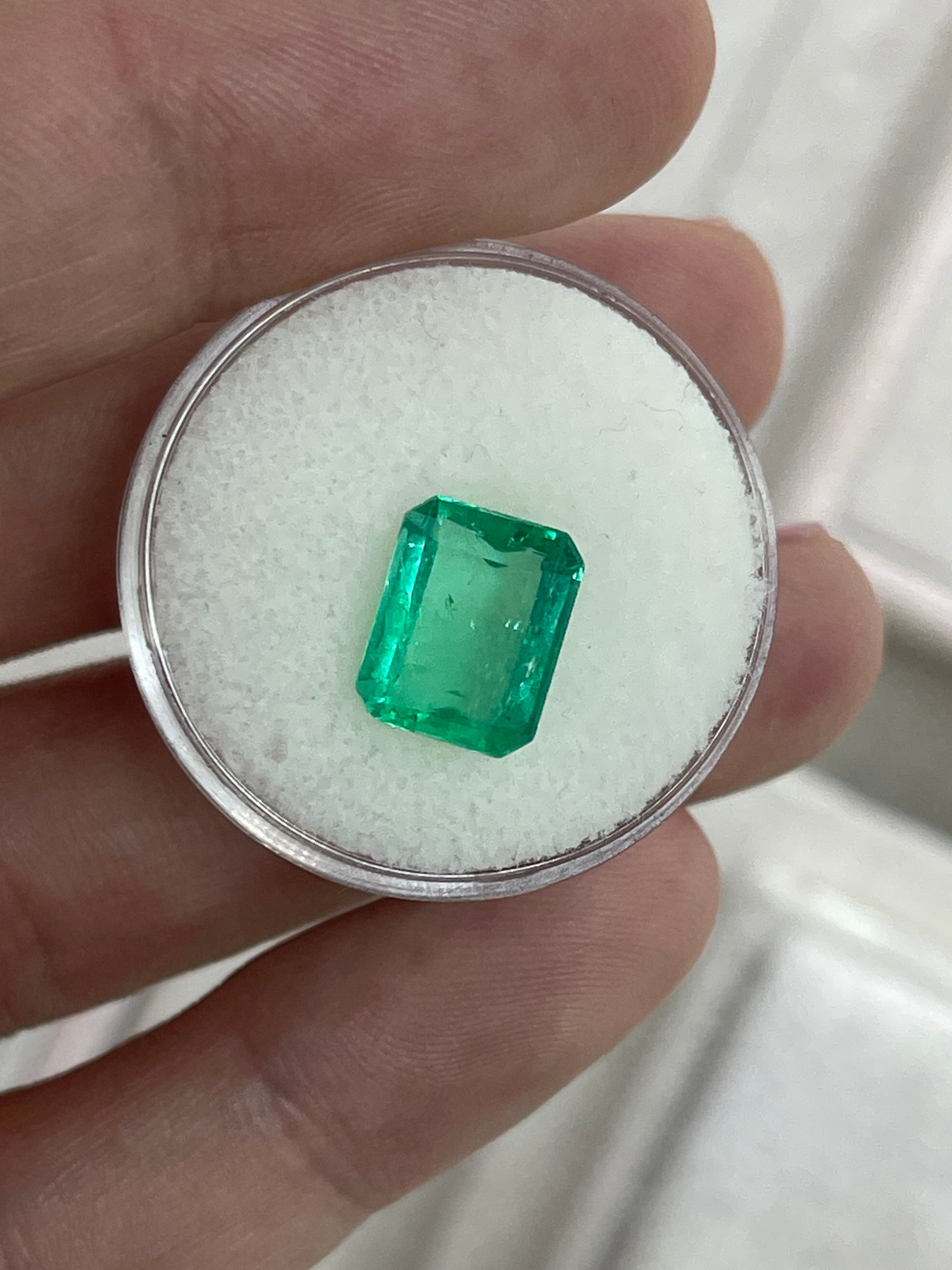 3.22ct Muzo Colombian emerald gemstone, yellowish-green crystal, spready cut, 10.4x8.4mm, earth-mined loose gemstone.