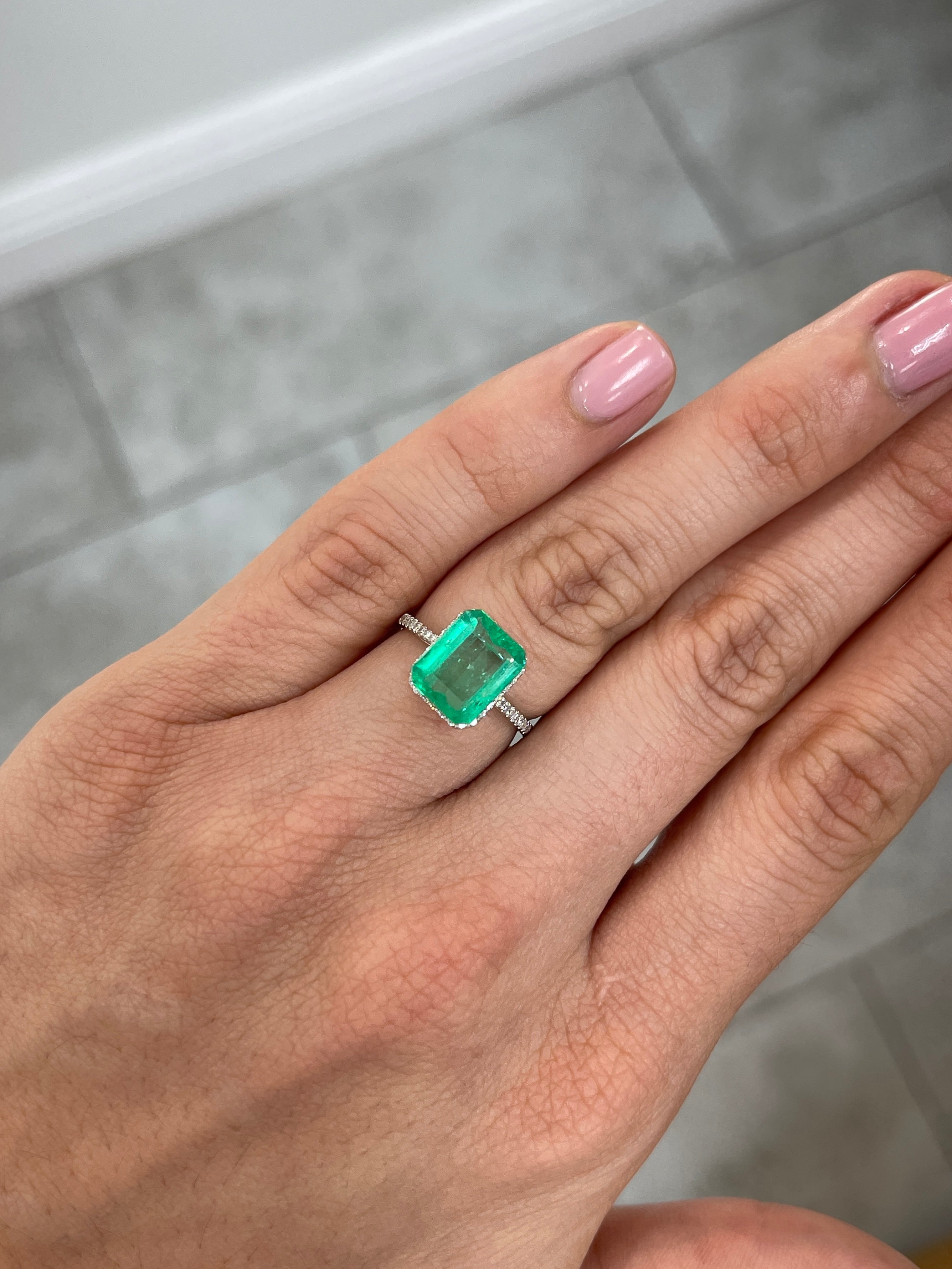 Loose 3.22ct Muzo Colombian emerald gemstone with yellowish green color, spready cut, 10.4x8.4mm, earth mined from Colombia.