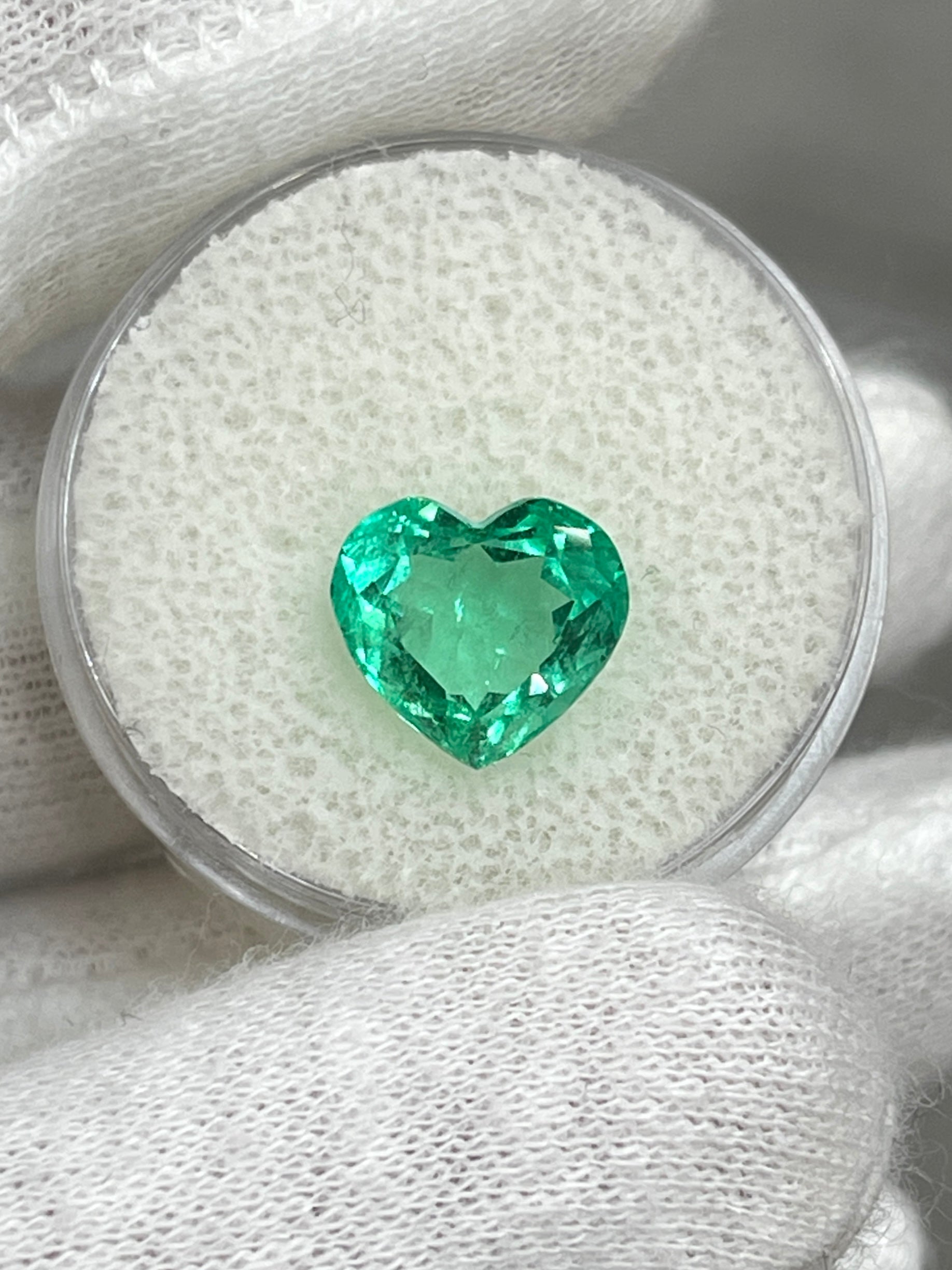 Bright green 3.24 carat Colombian emerald heart cut, authentic gemstone from JR Colombian Emeralds, showcasing vibrant color and clarity.