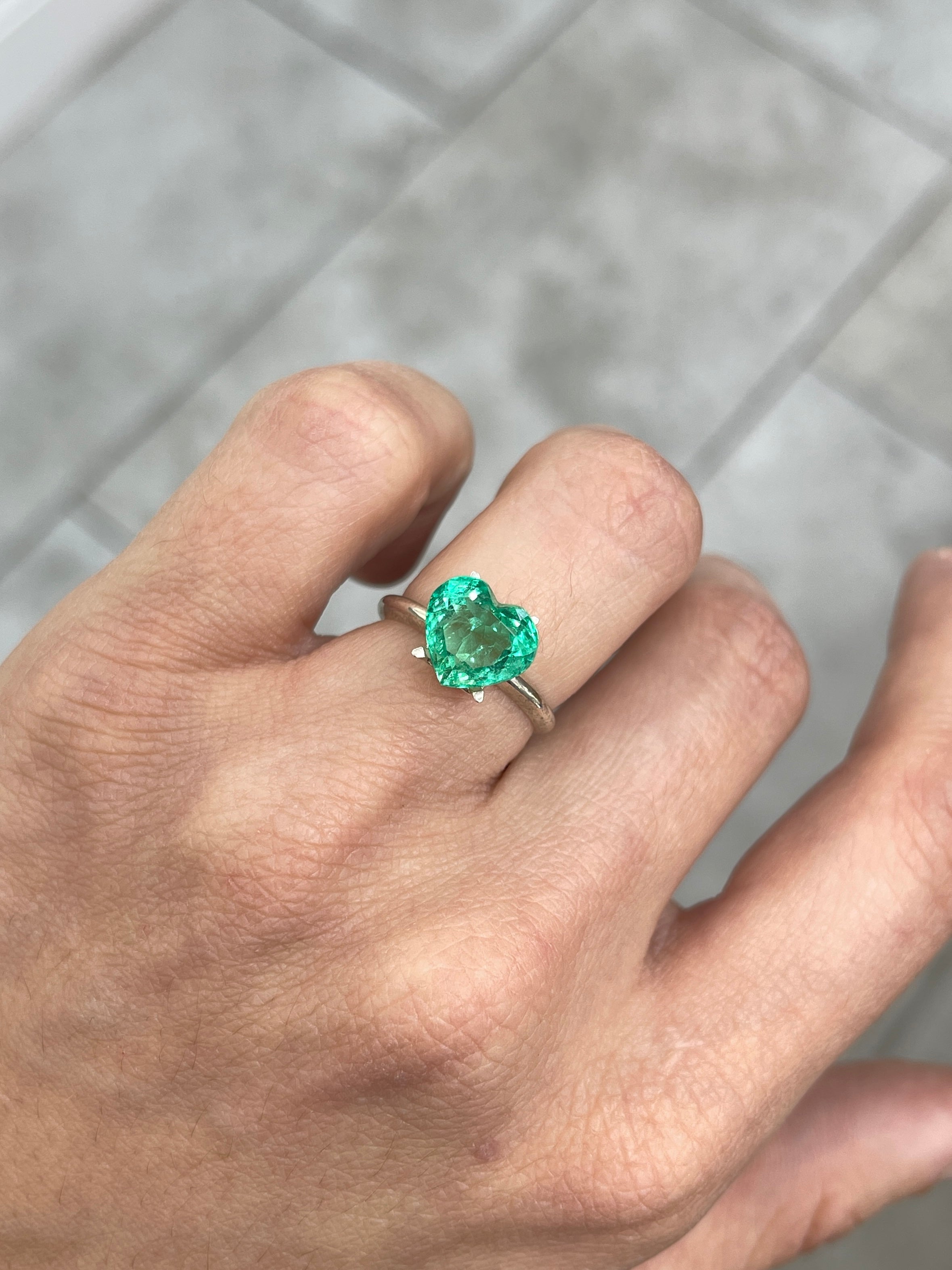Bright medium green 3.24 carat Colombian emerald heart cut gemstone by JR Colombian Emeralds, showing detailed facets and rich color.