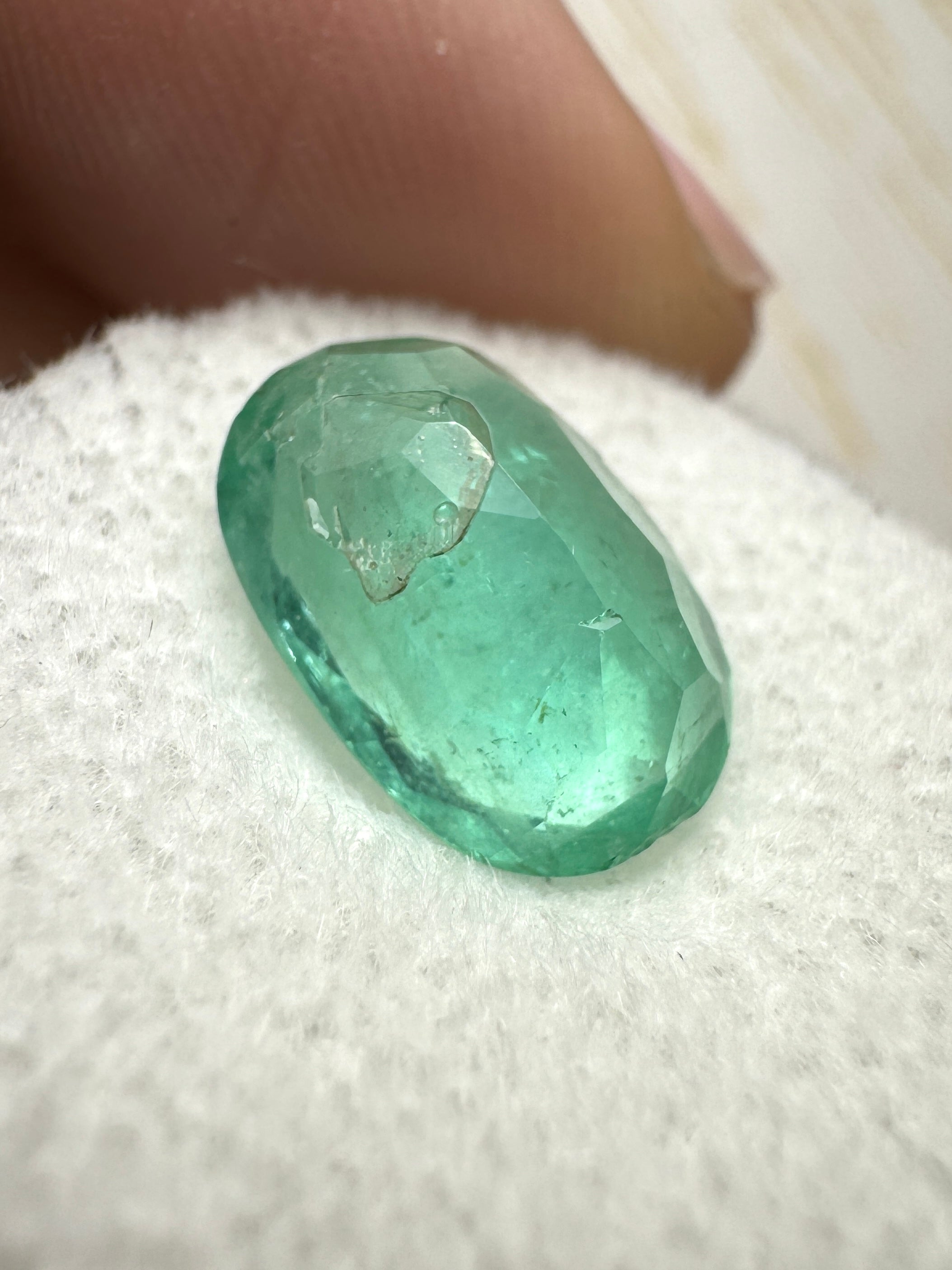 Oval cut 3.25 carat green natural Colombian emerald loose gemstone from JR Colombian Emeralds, showcasing vibrant color and clarity.