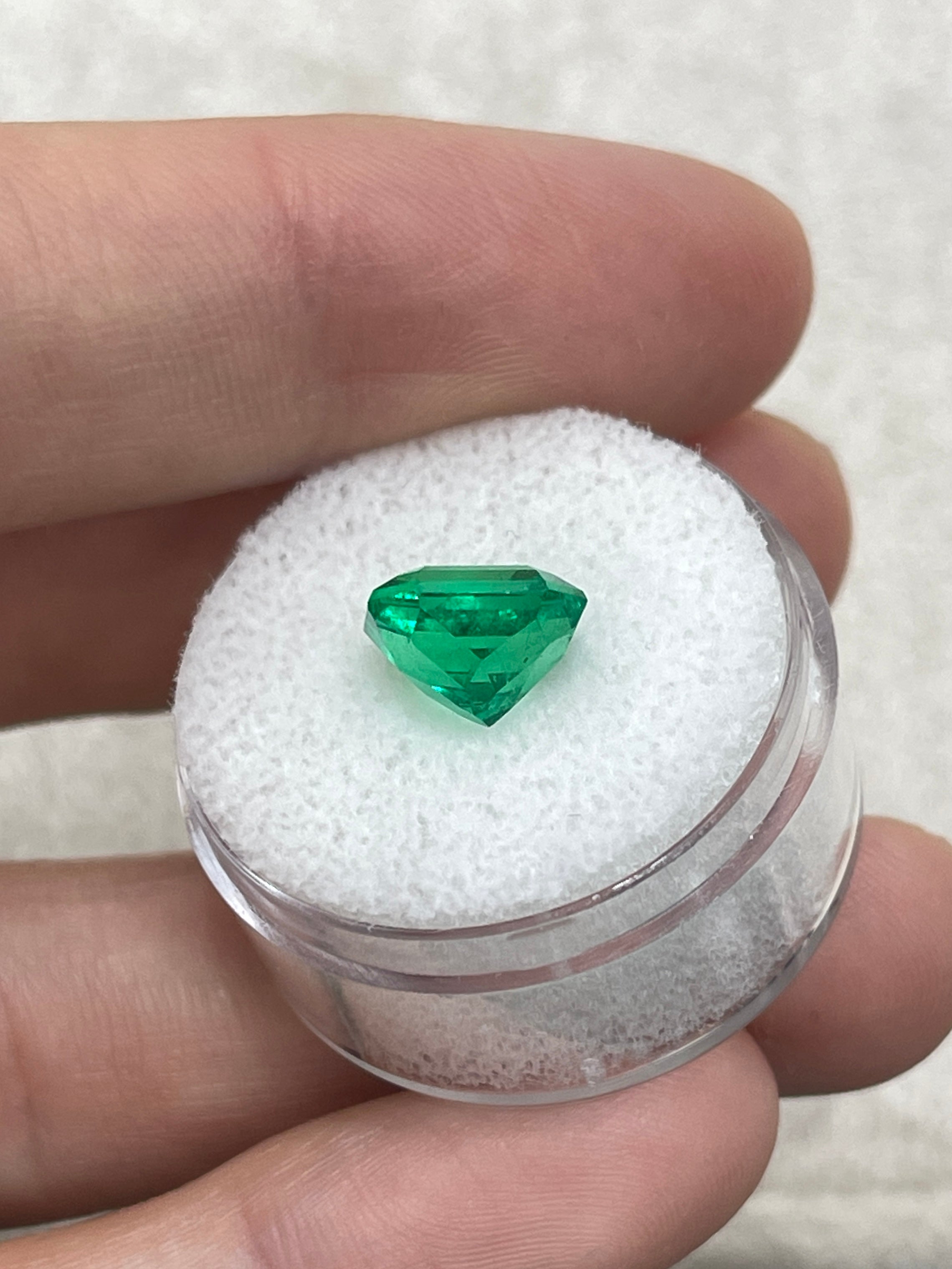 3.26 carat vivid yellowish green Colombian emerald in an emerald cut, showcased by JR Colombian Emeralds.