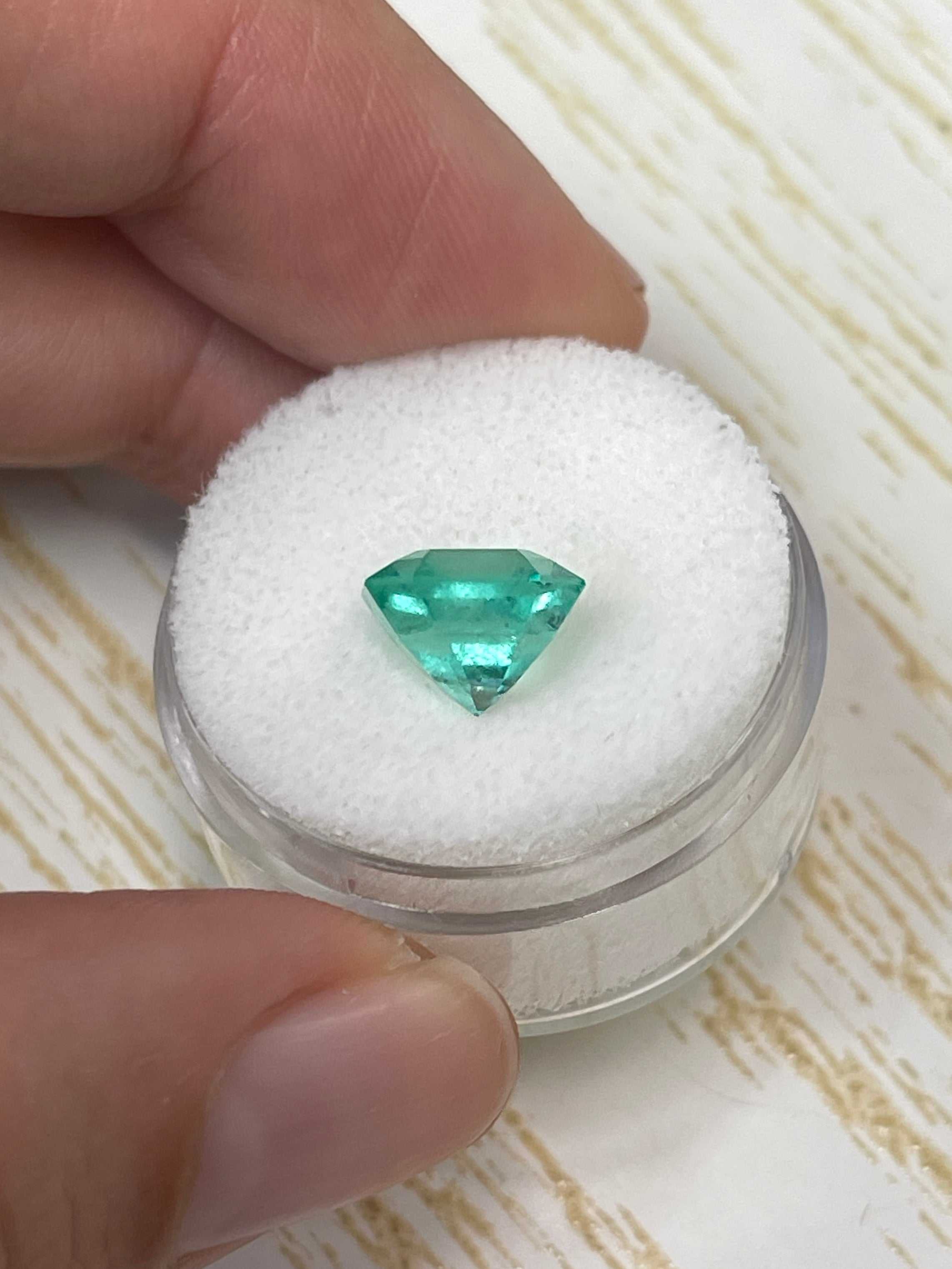 Natural 3.27 carat Colombian emerald in an Asscher cut, showcasing vibrant green color and clarity, from JR Colombian Emeralds.
