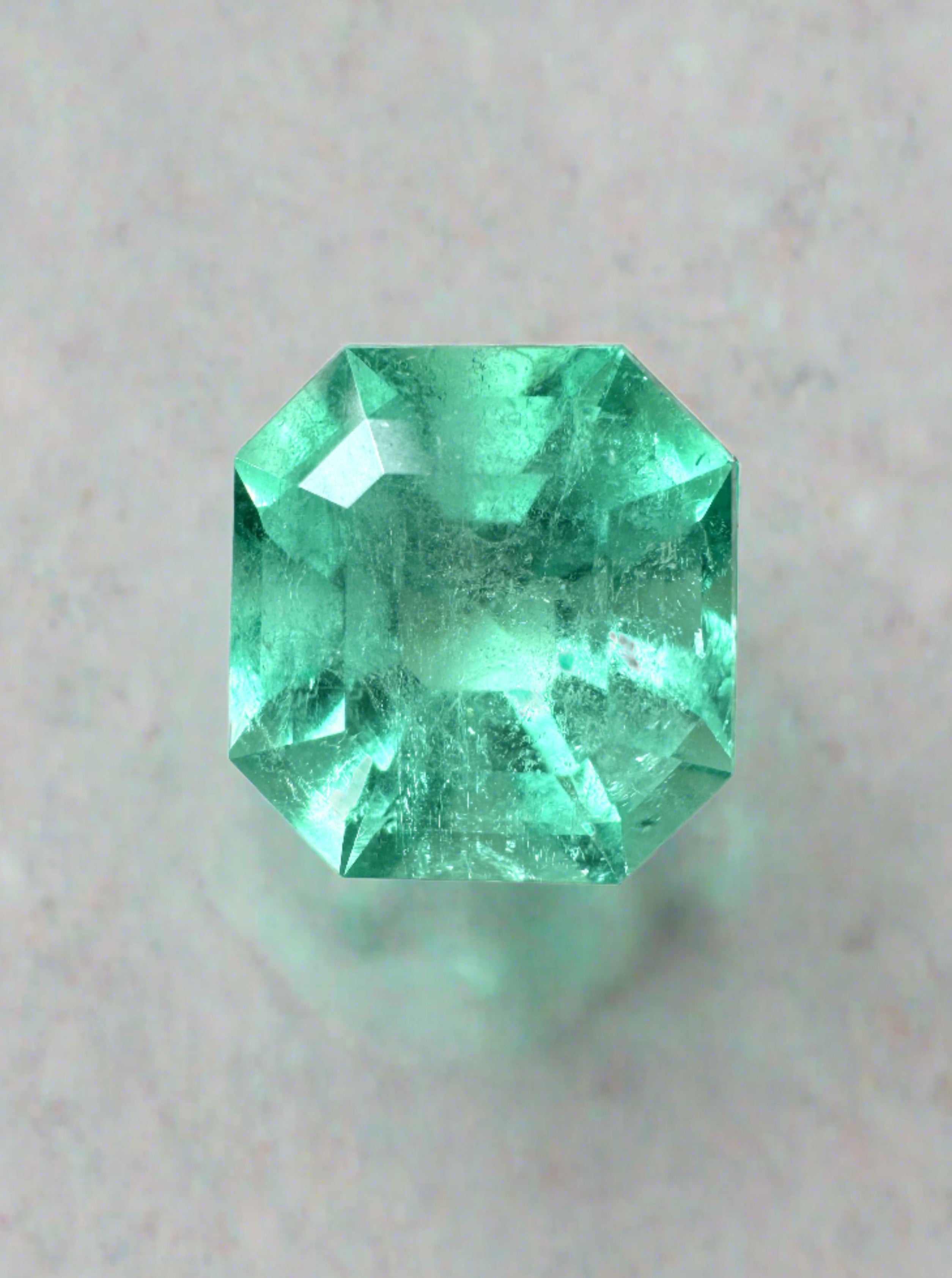 Natural 3.27 carat Colombian emerald in Asscher cut, weighing 9.3x8.8mm, from JR Colombian Emeralds, with vibrant green hue.