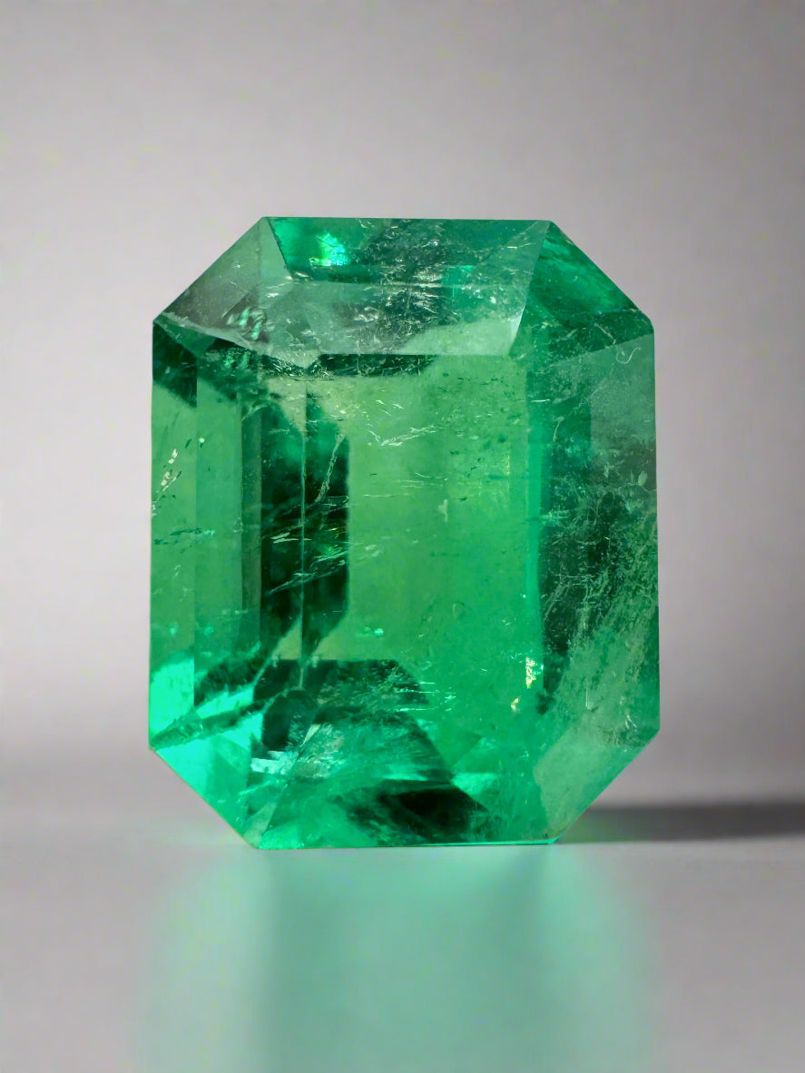 Loose 3.30 carat glowing green Colombian emerald in an emerald cut, natural and vibrant, from JR Colombian Emeralds.