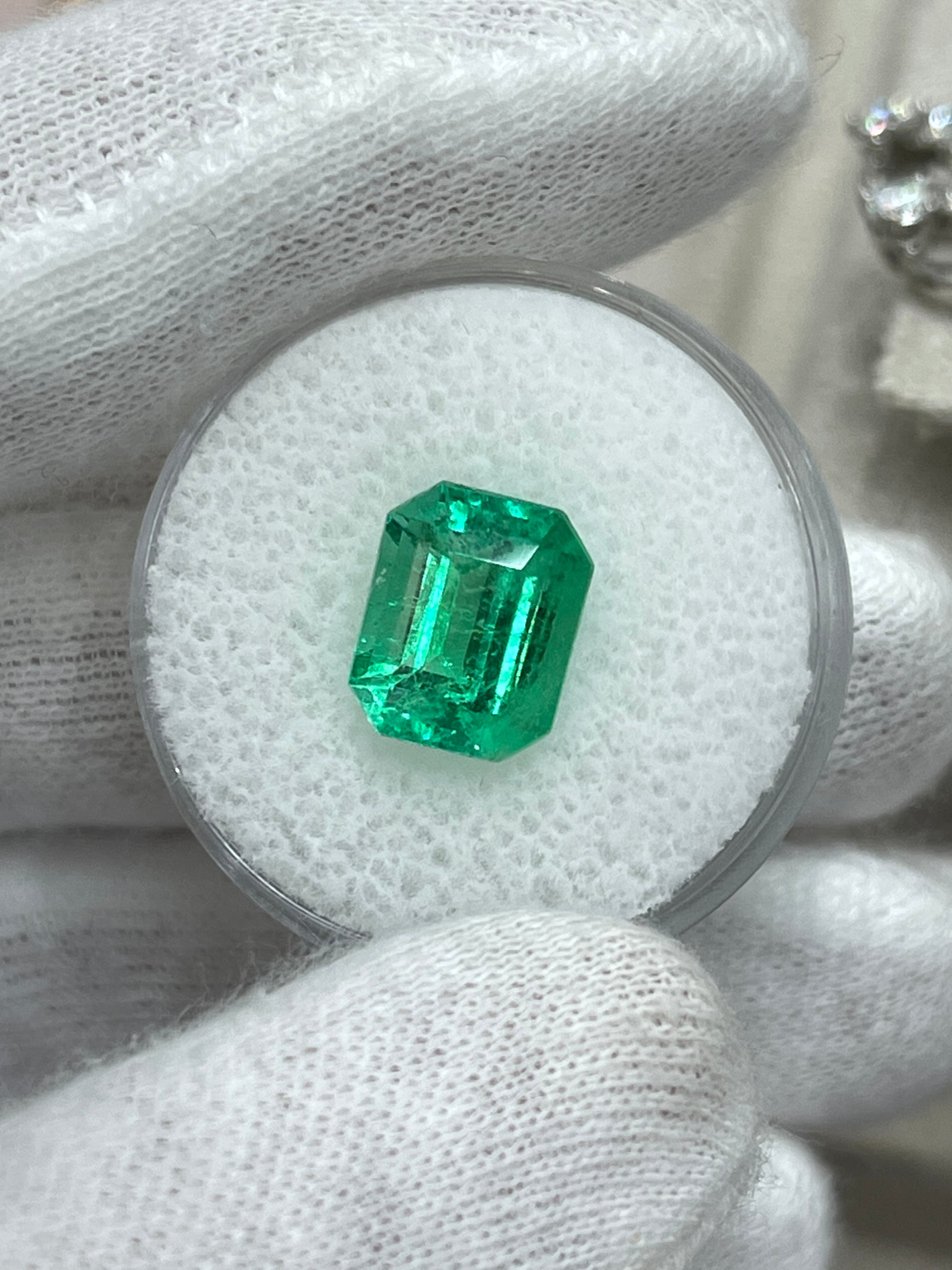 3.30 carat glowing green natural Colombian emerald in emerald cut, loose gemstone from JR Colombian Emeralds.