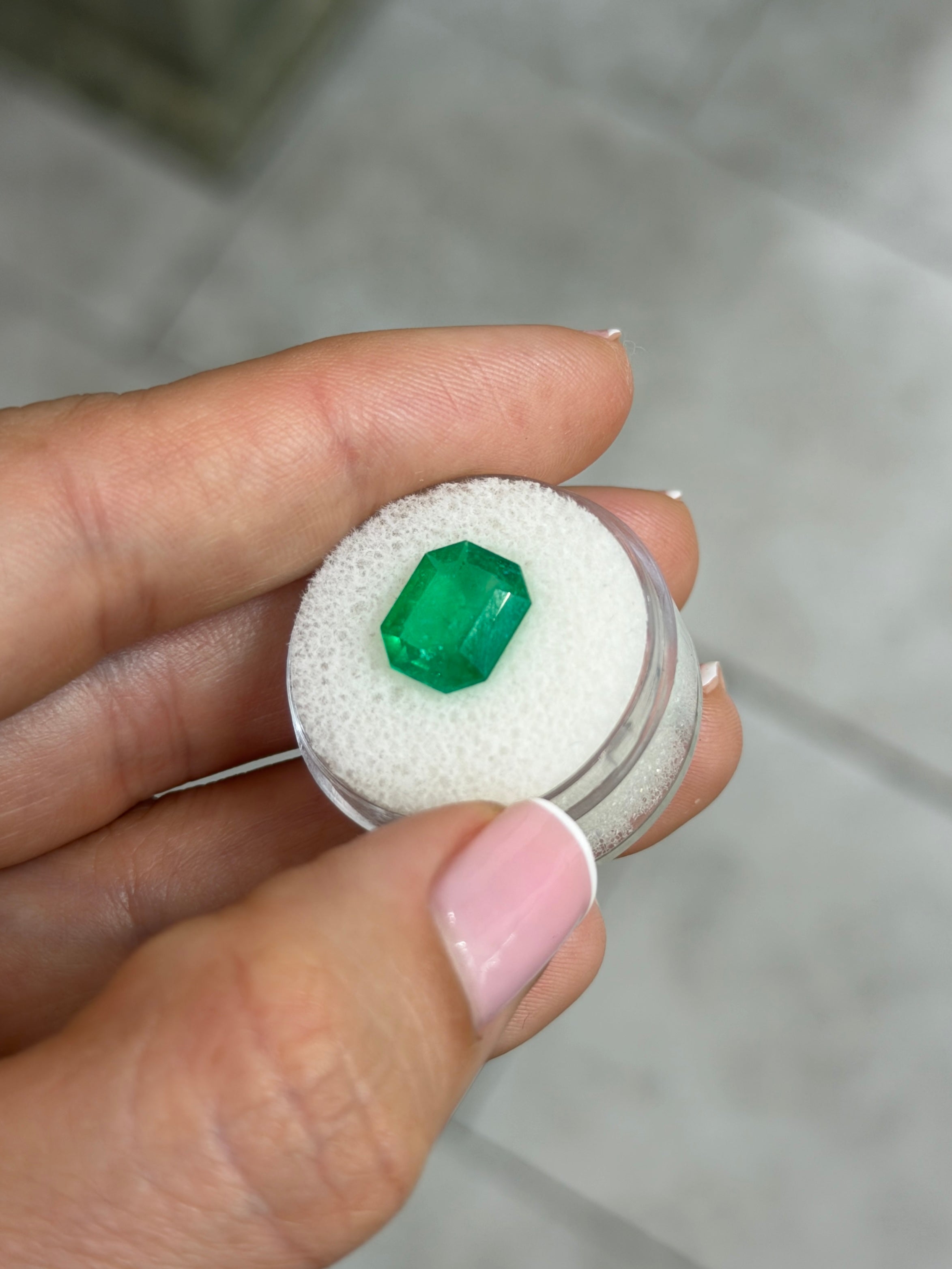 3.30 carat natural Colombian Muzo emerald gemstone with an emerald cut, vibrant green color, loose gemstone by JR Colombian Emeralds