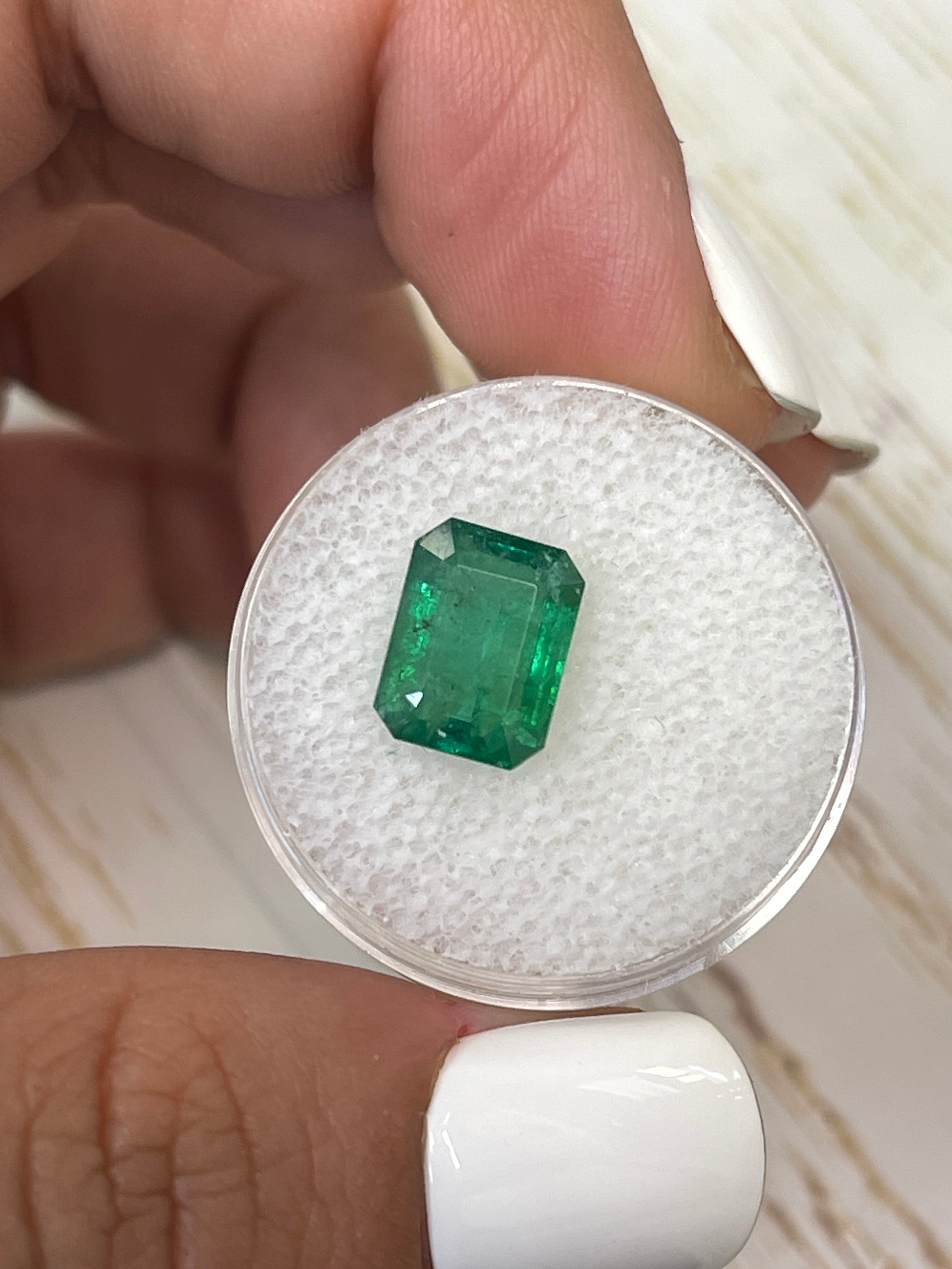 3.31 carat mossy green natural Zambian emerald in emerald cut, loose gemstone from JR Colombian Emeralds.